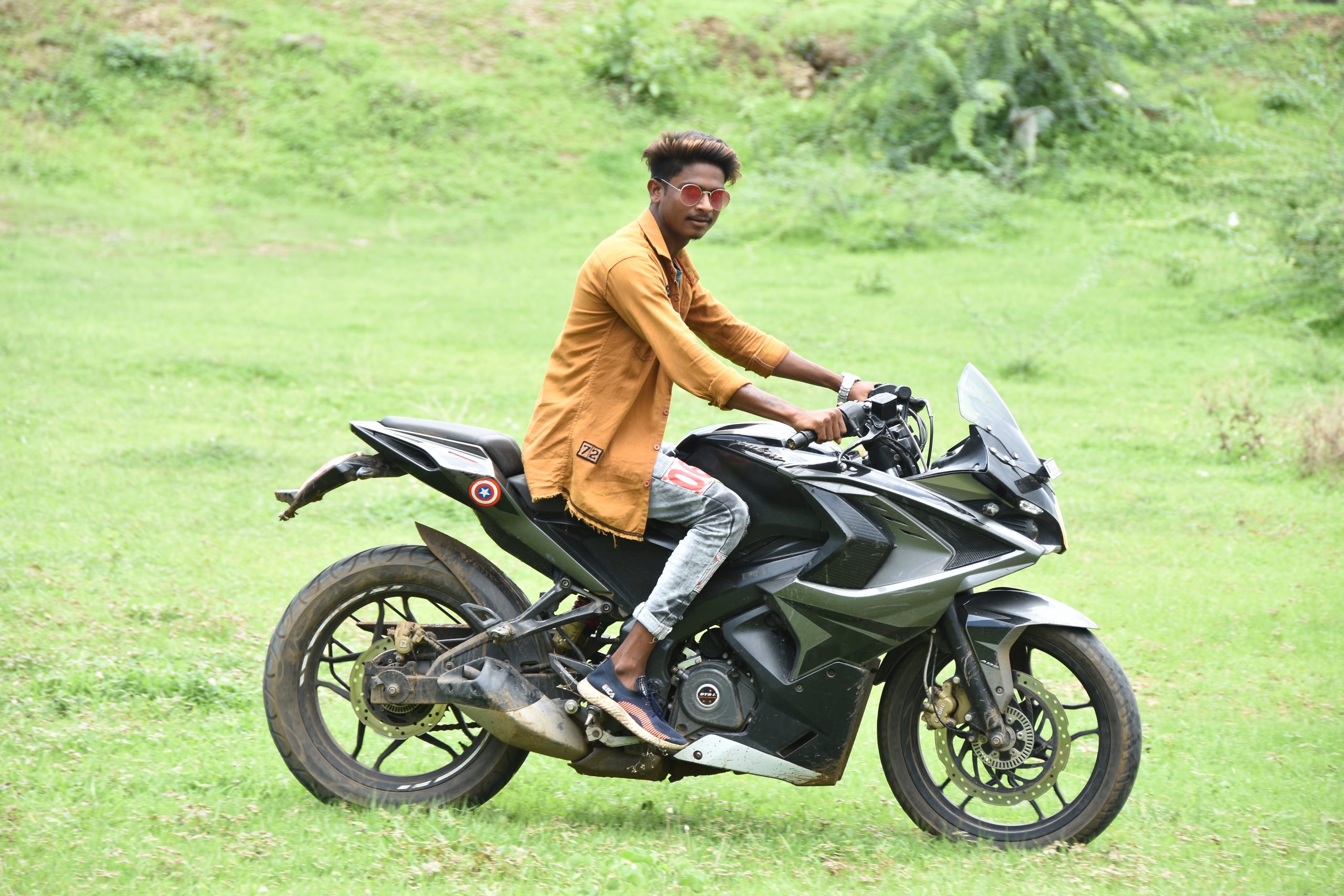 Boy on bike in farm