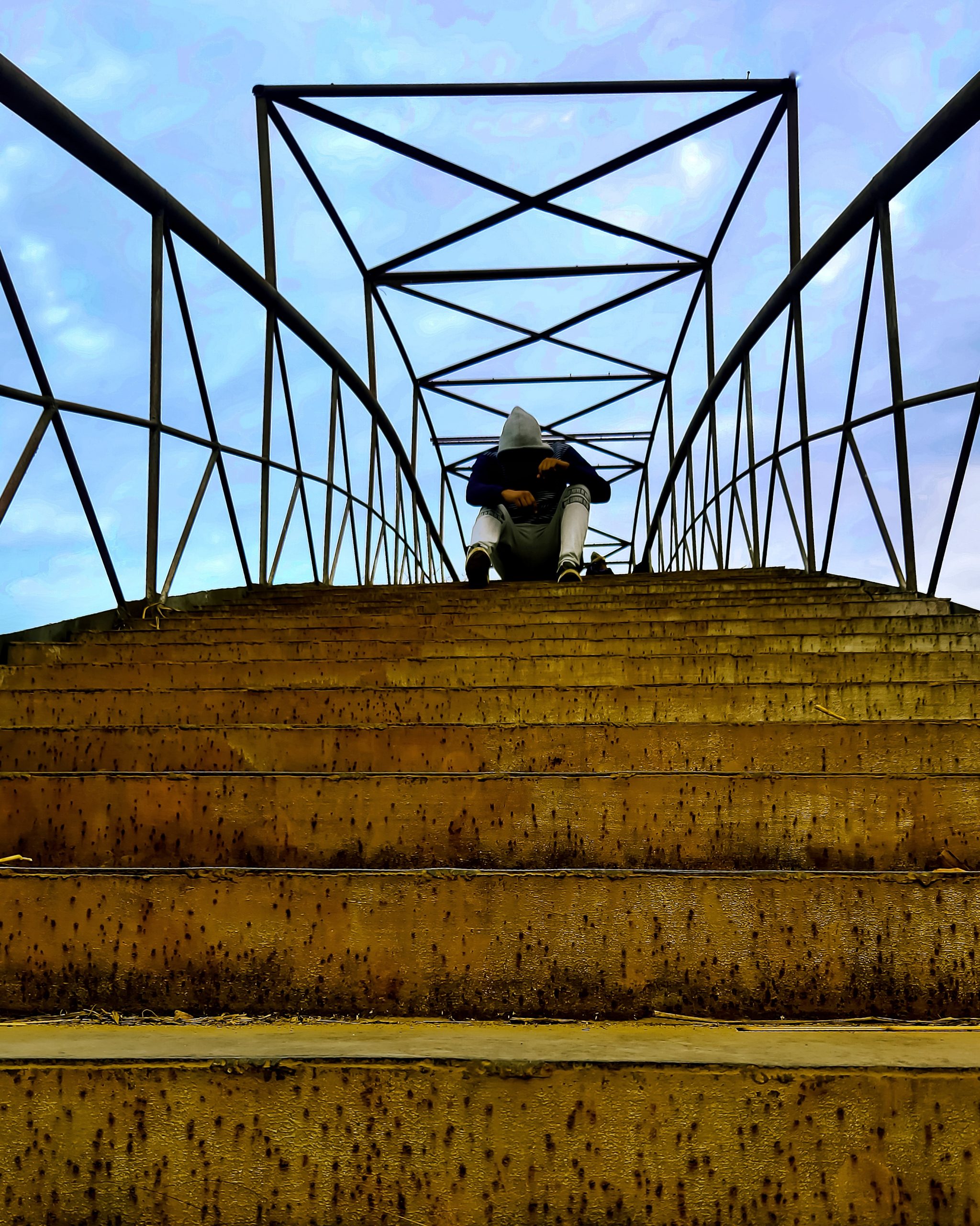 Boy posing on bridge