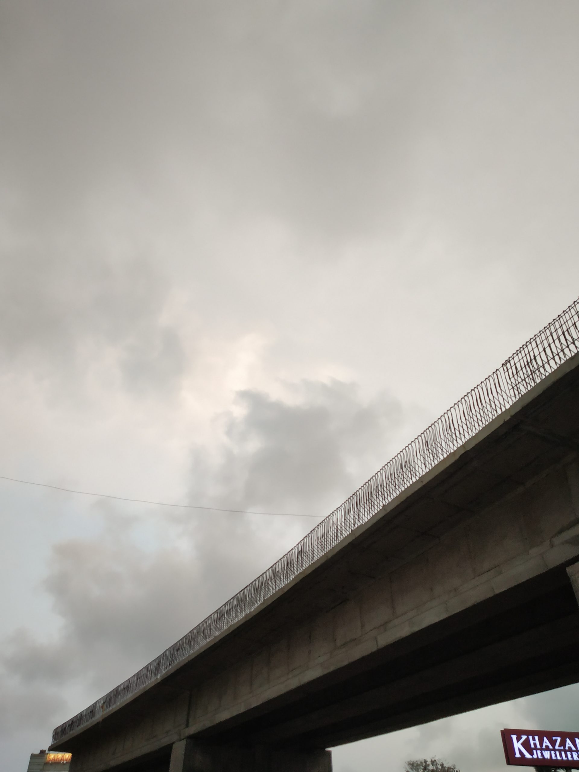 Bridge under the cloudy sky