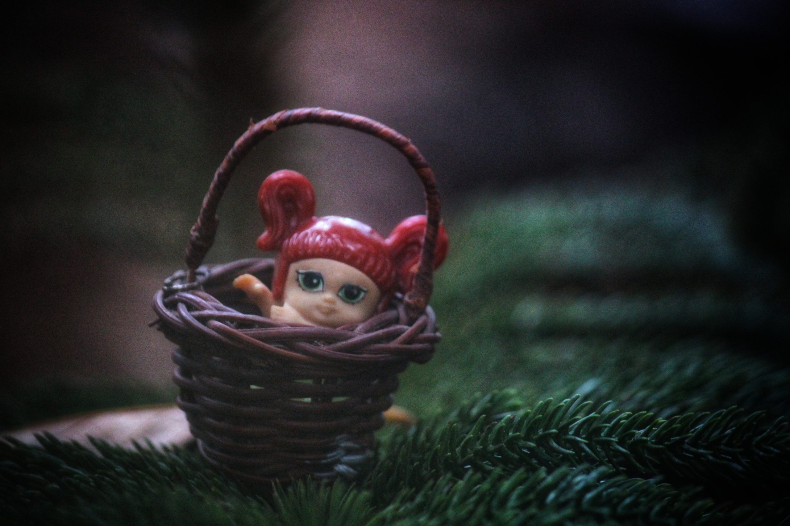 Doll toy in basket