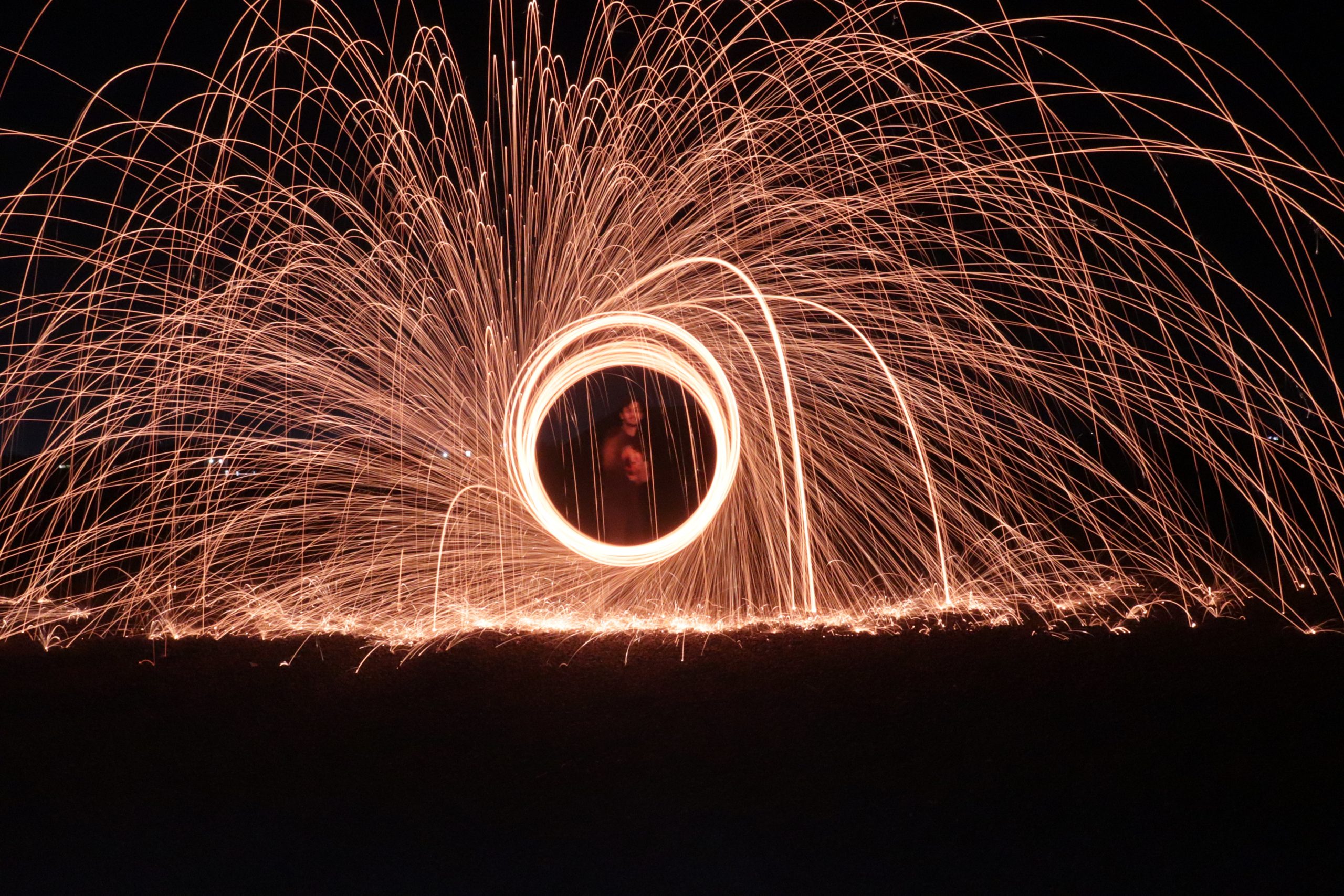 Girl making circle with firework