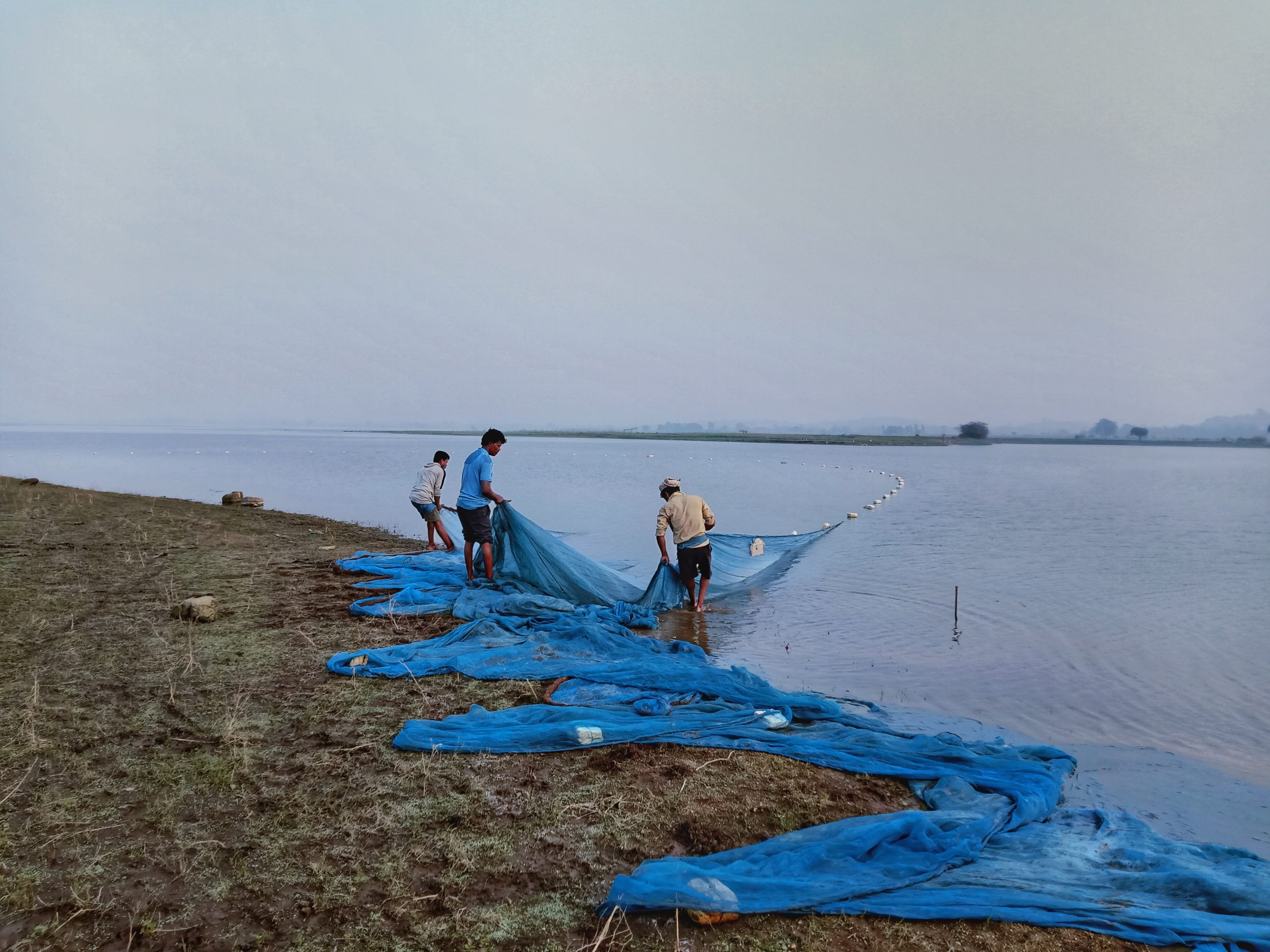 Fishermen pulling fishing net