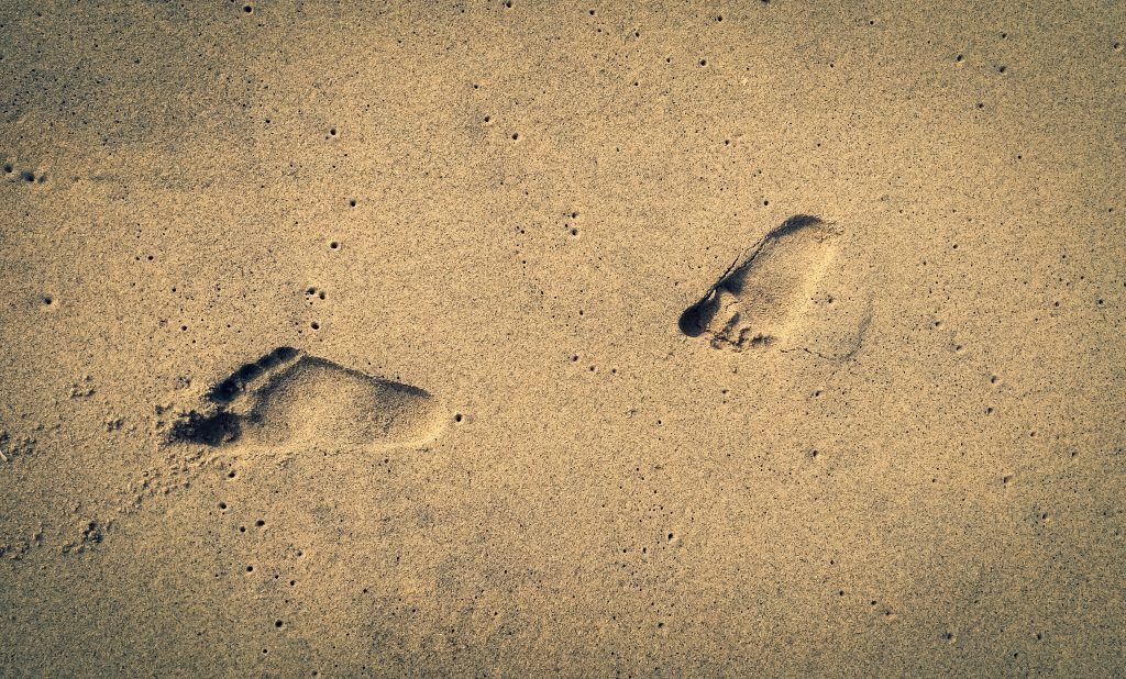Foot marks on a beach PixaHive