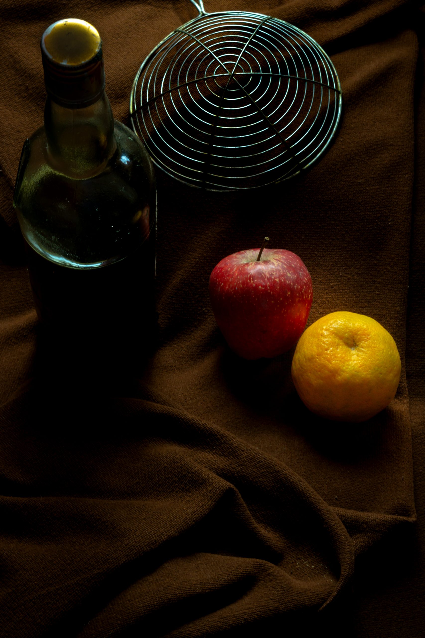 Fruits with bottle on bed