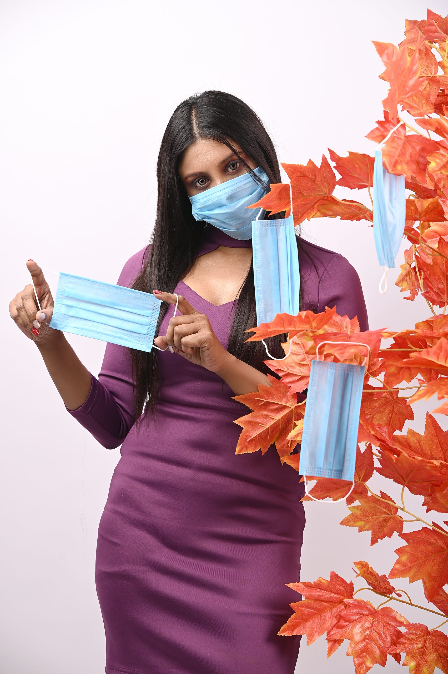 Model posing with mask