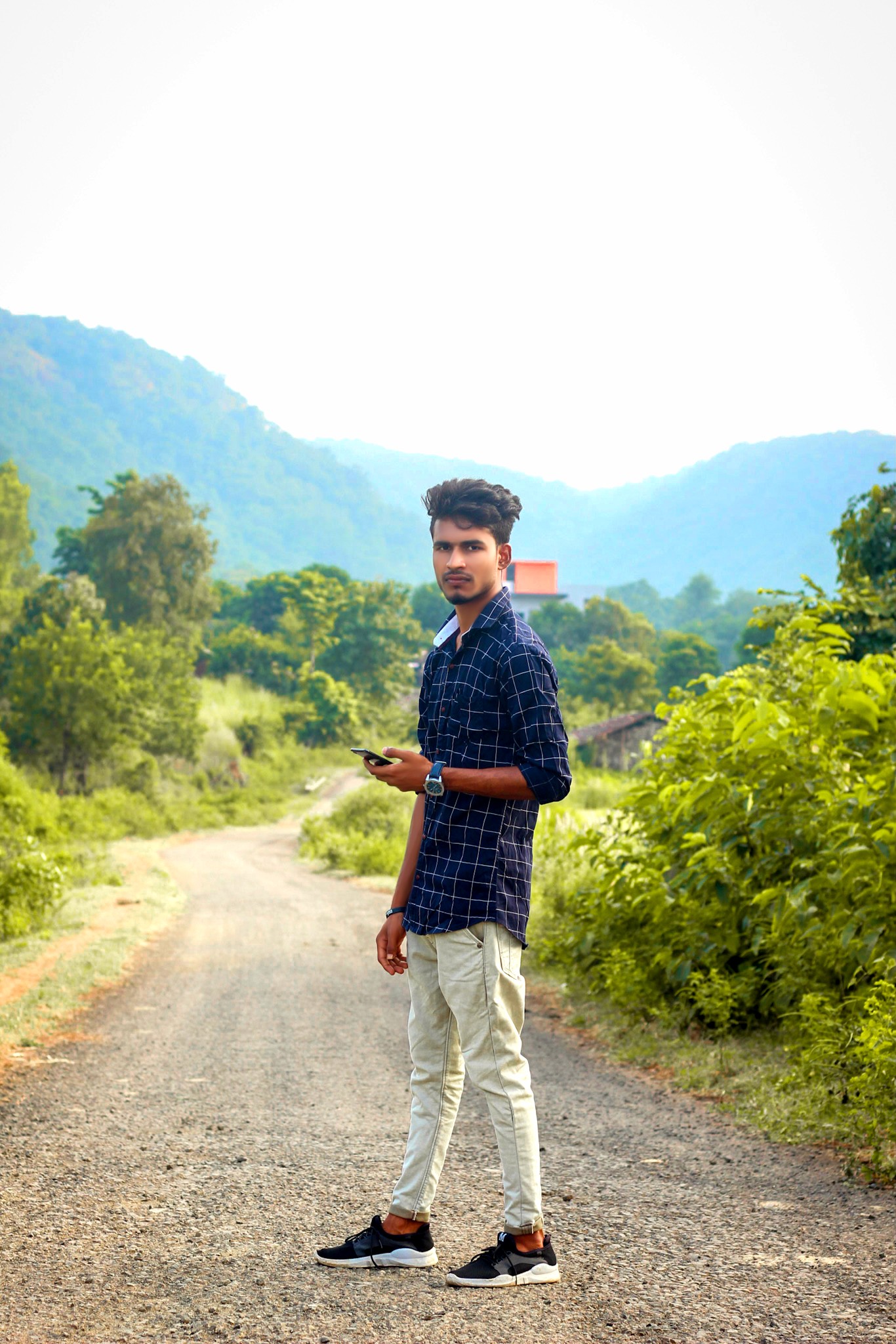 Guy standing on a trail