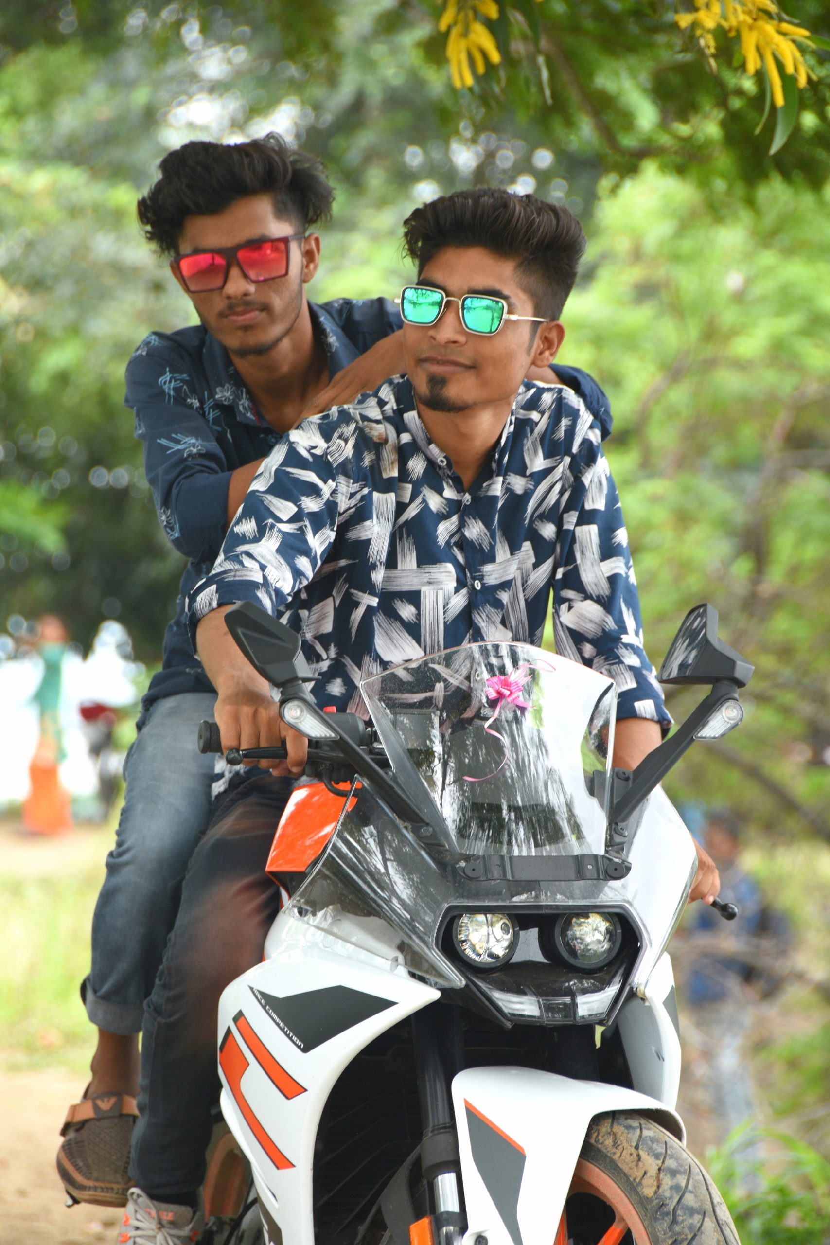 Two boys posing on KTM bike