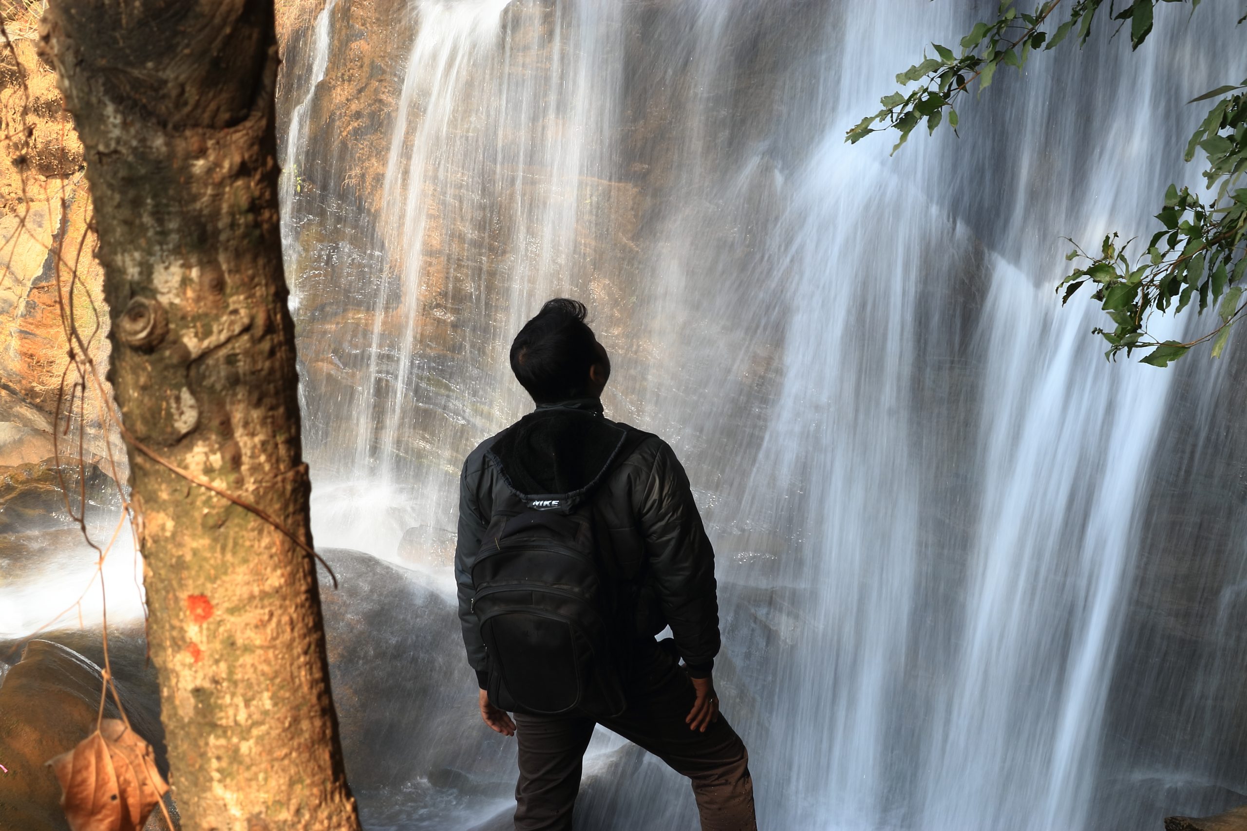 Man looking at Waterfall