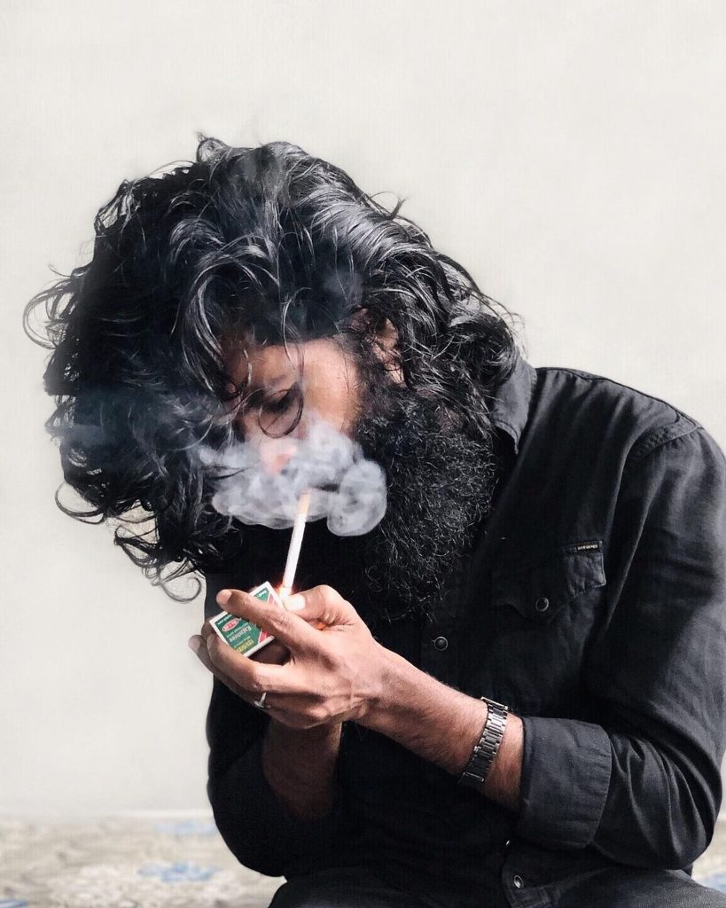 Man lighting a cigarette PixaHive