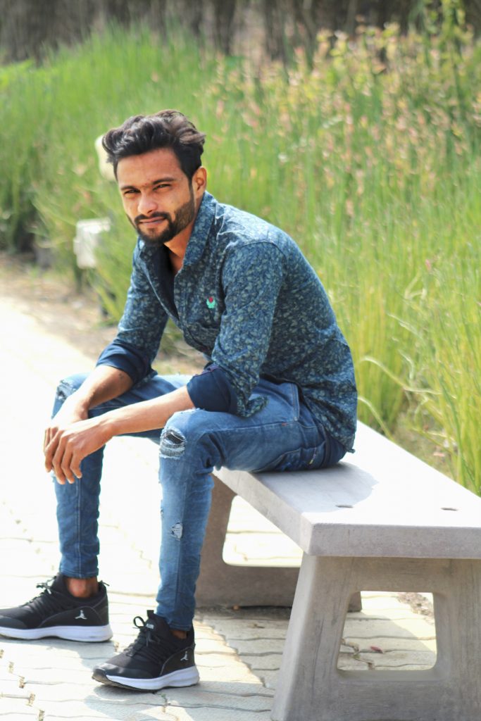 Man sitting on bench in farm - PixaHive