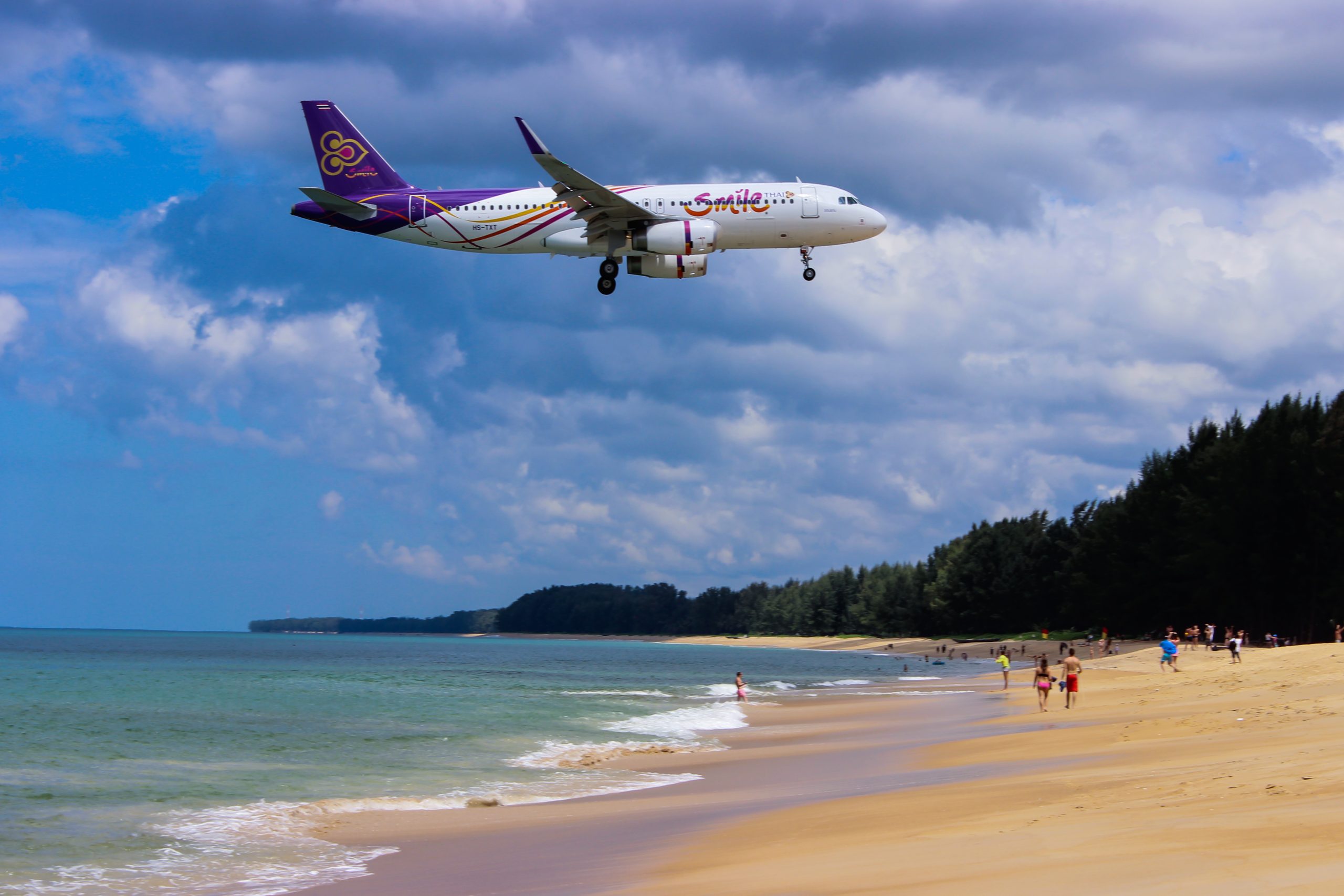 A flight going over a beach in Phuket