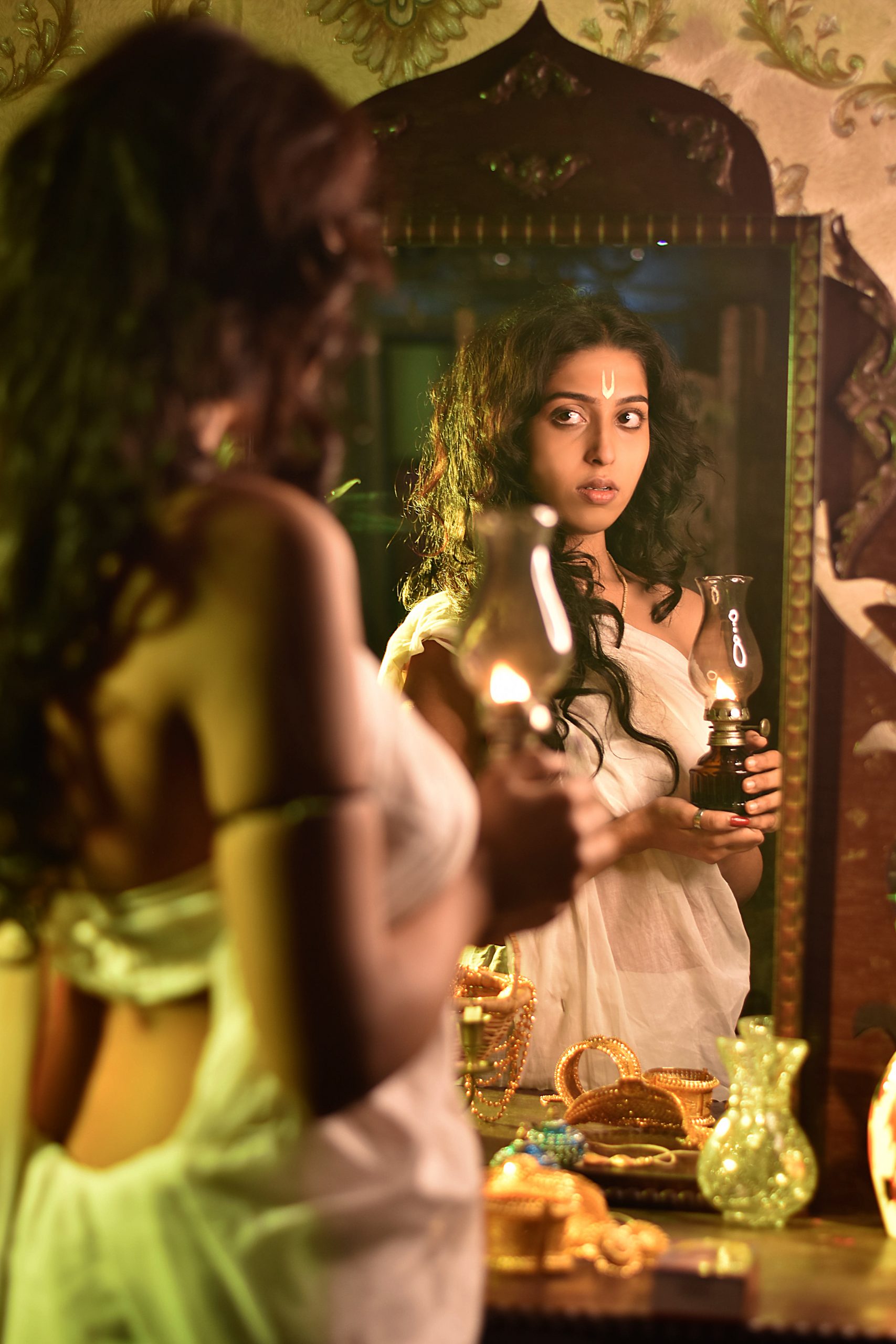 Girl in saree in front of mirror