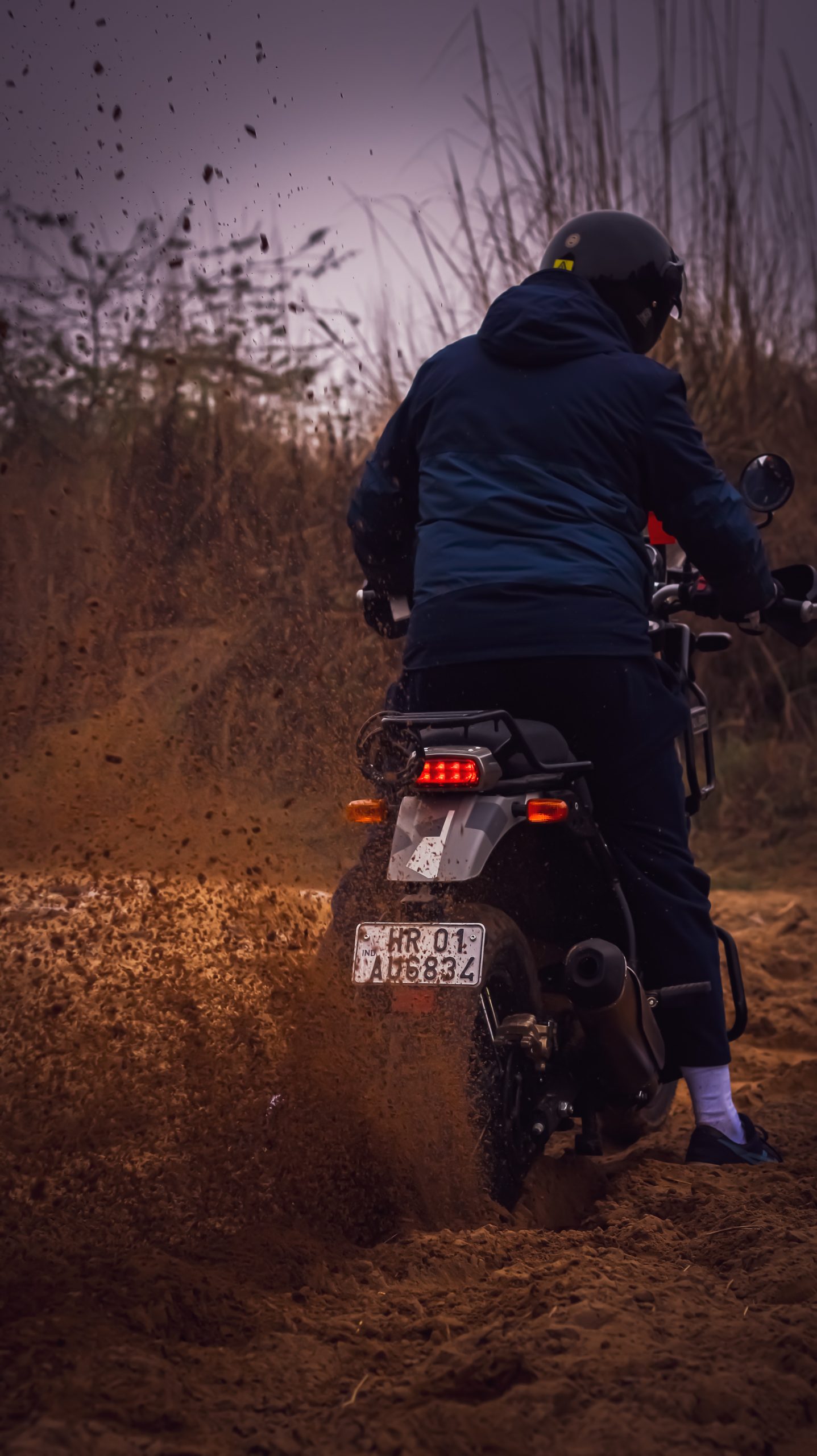 Rider riding bike in mud