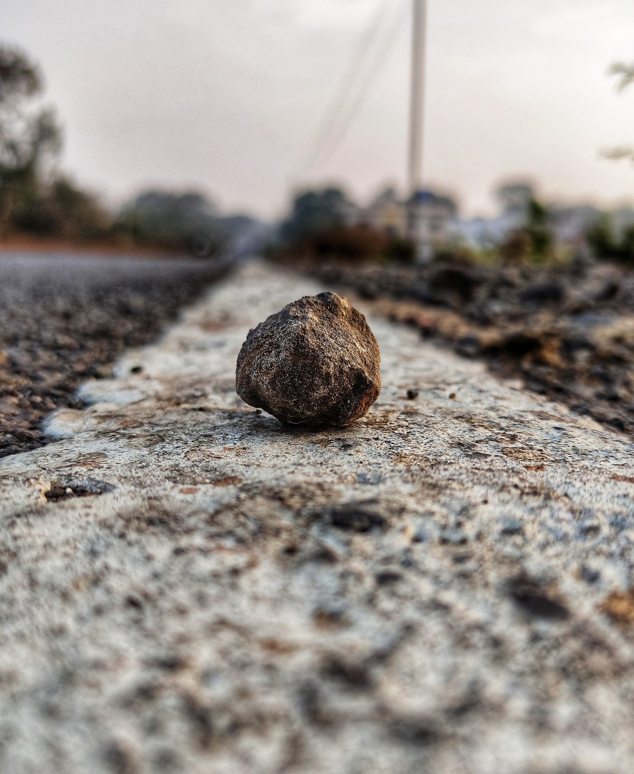 Stone on road marking strip