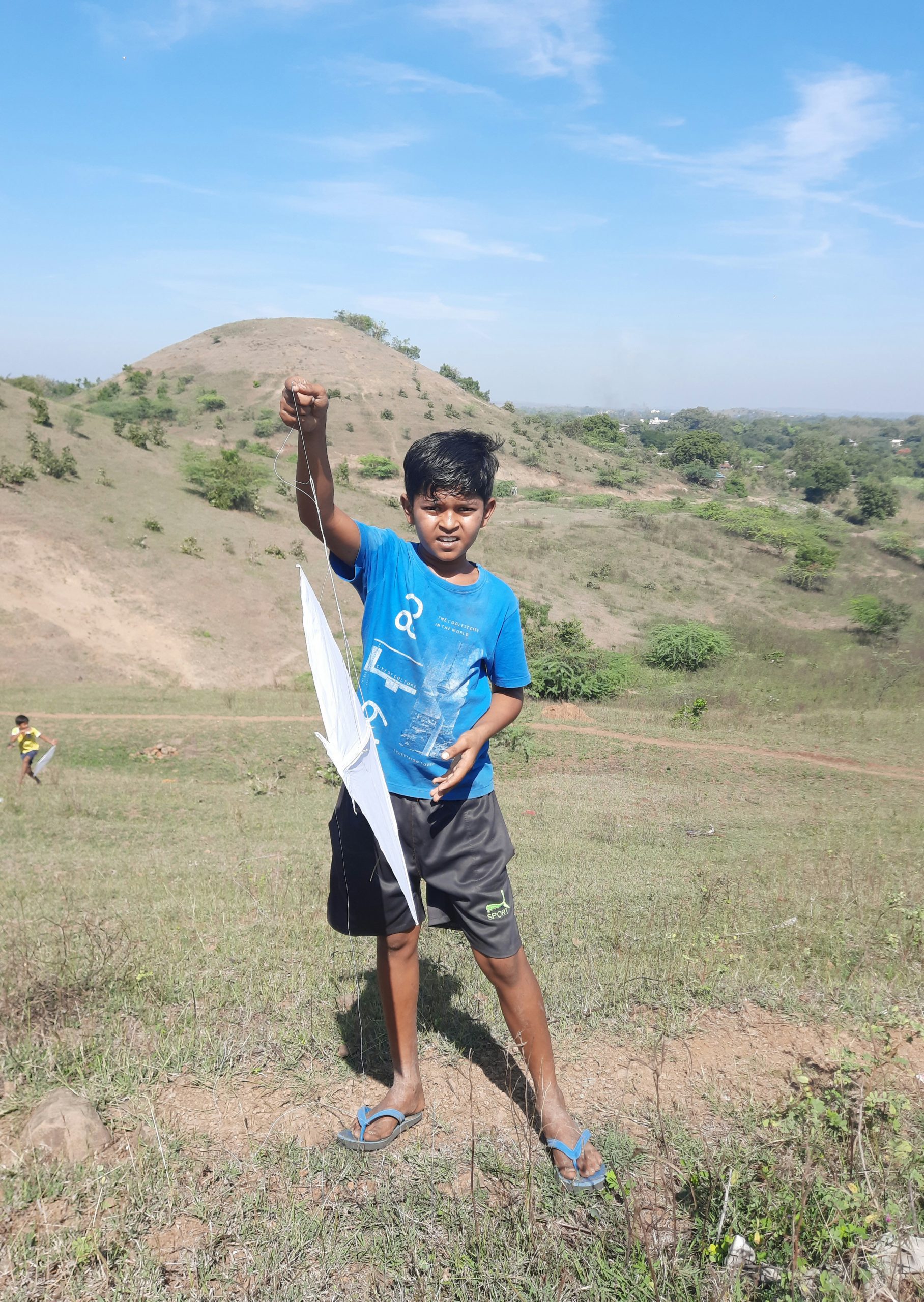 A kid flying a kite