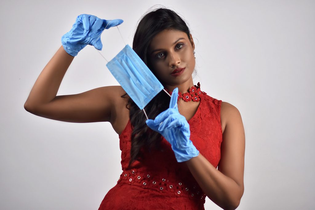 Woman holding mask PixaHive