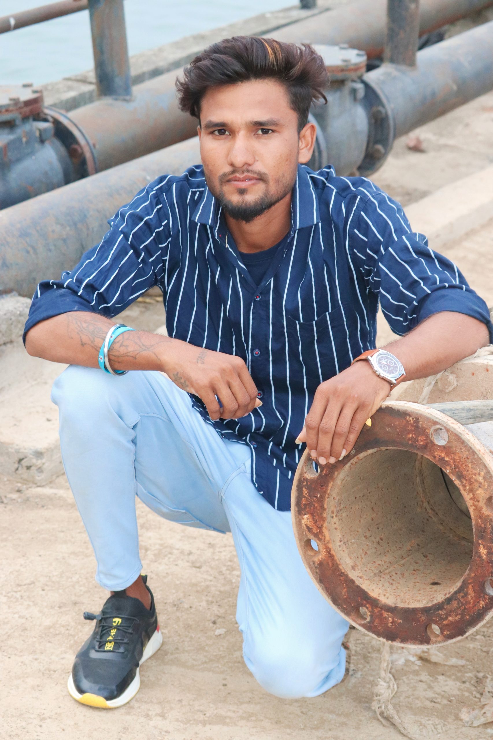 A boy near pipes