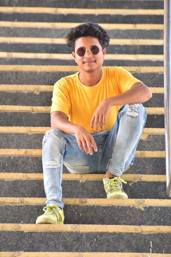Young teenage girl sitting on stairs of house entrance, wear on yellow  t-shirt, jeans and sunglasses. 6755031 Stock Photo at Vecteezy