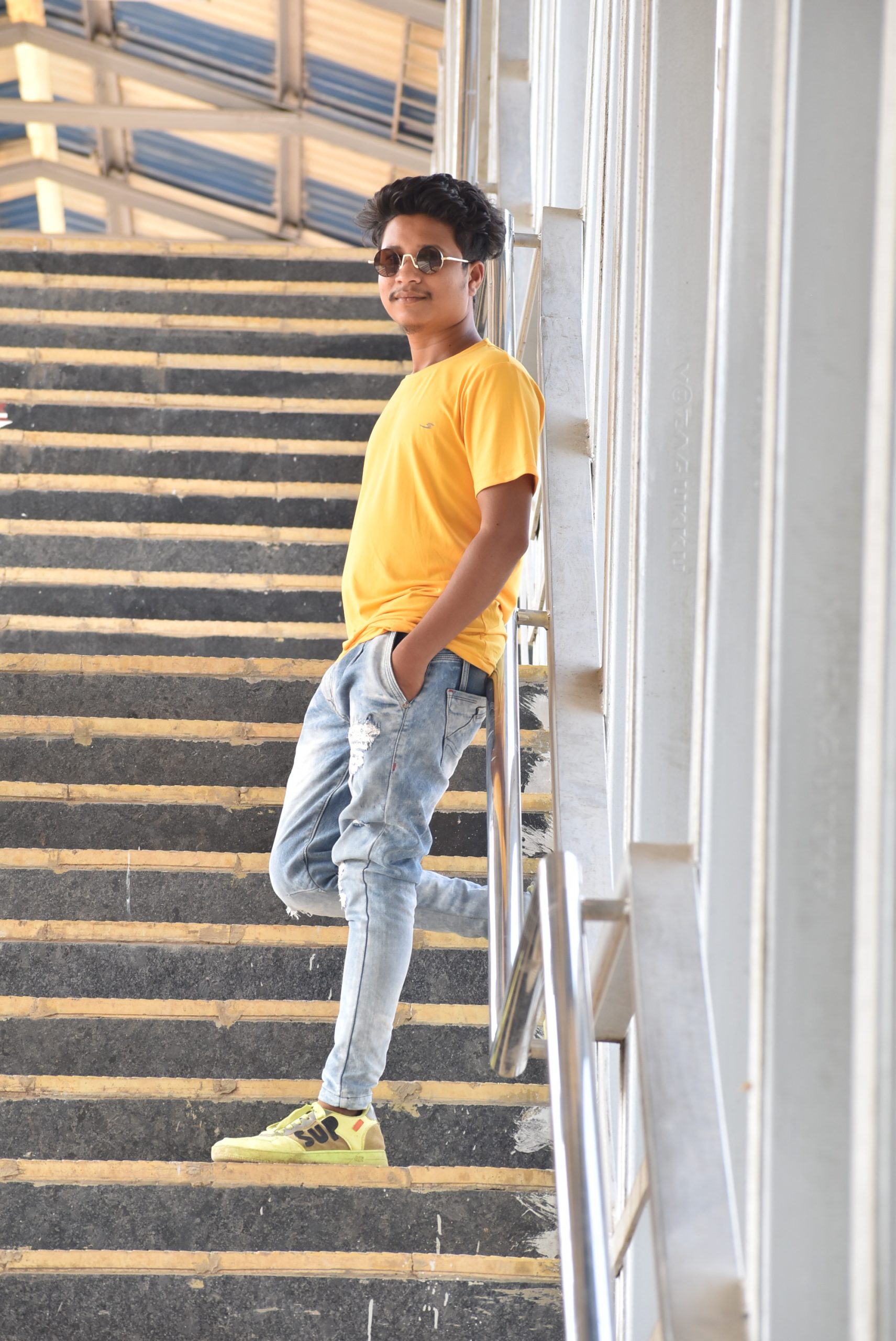 A boy standing on stairs