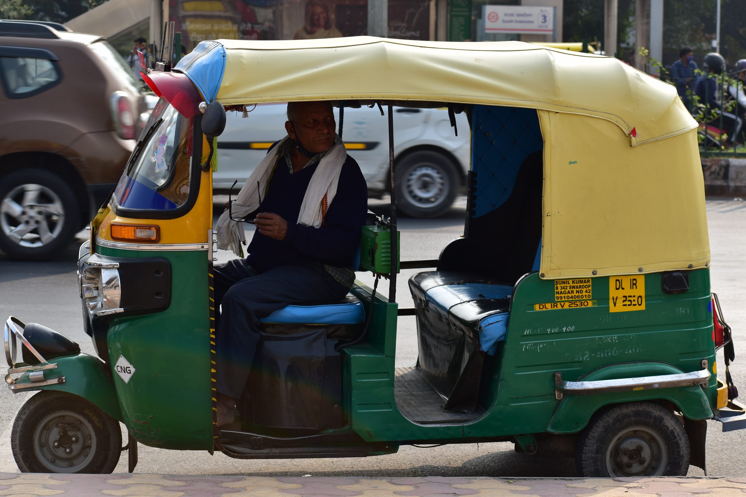 A man riding auto rickshaw