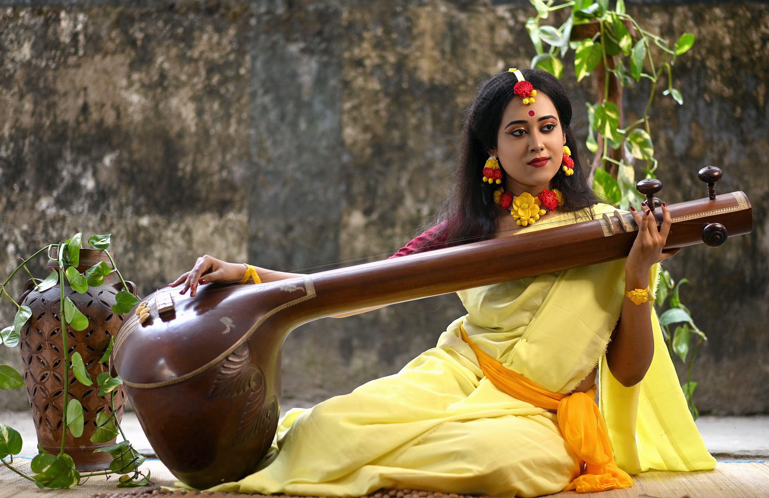A woman playing Saraswati veena