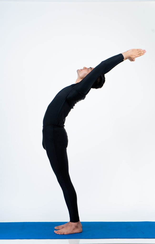 Yoga ardha chakrasana pose stock photo. Image of health - 24847320