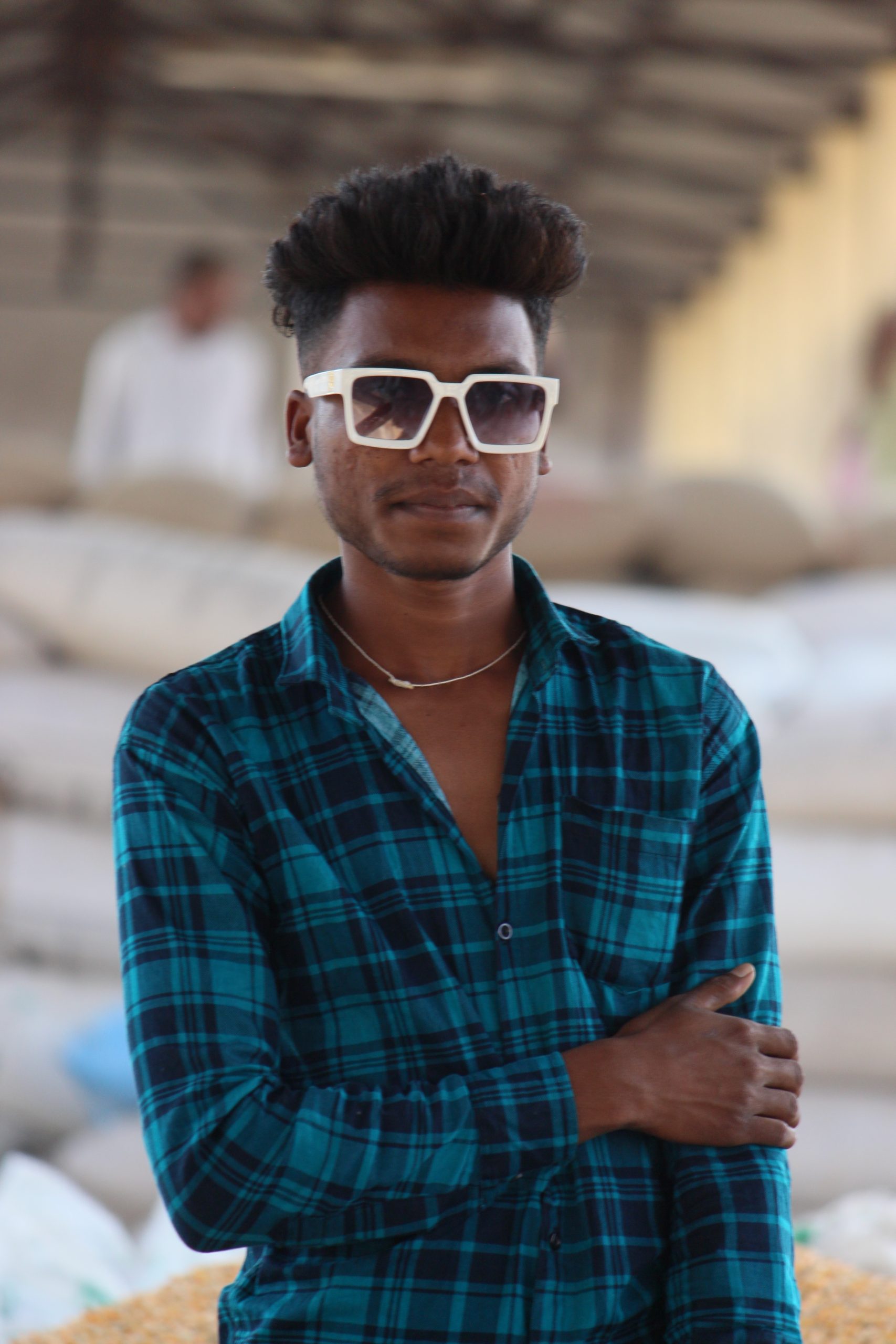 Boy posing while wearing Sunglasses