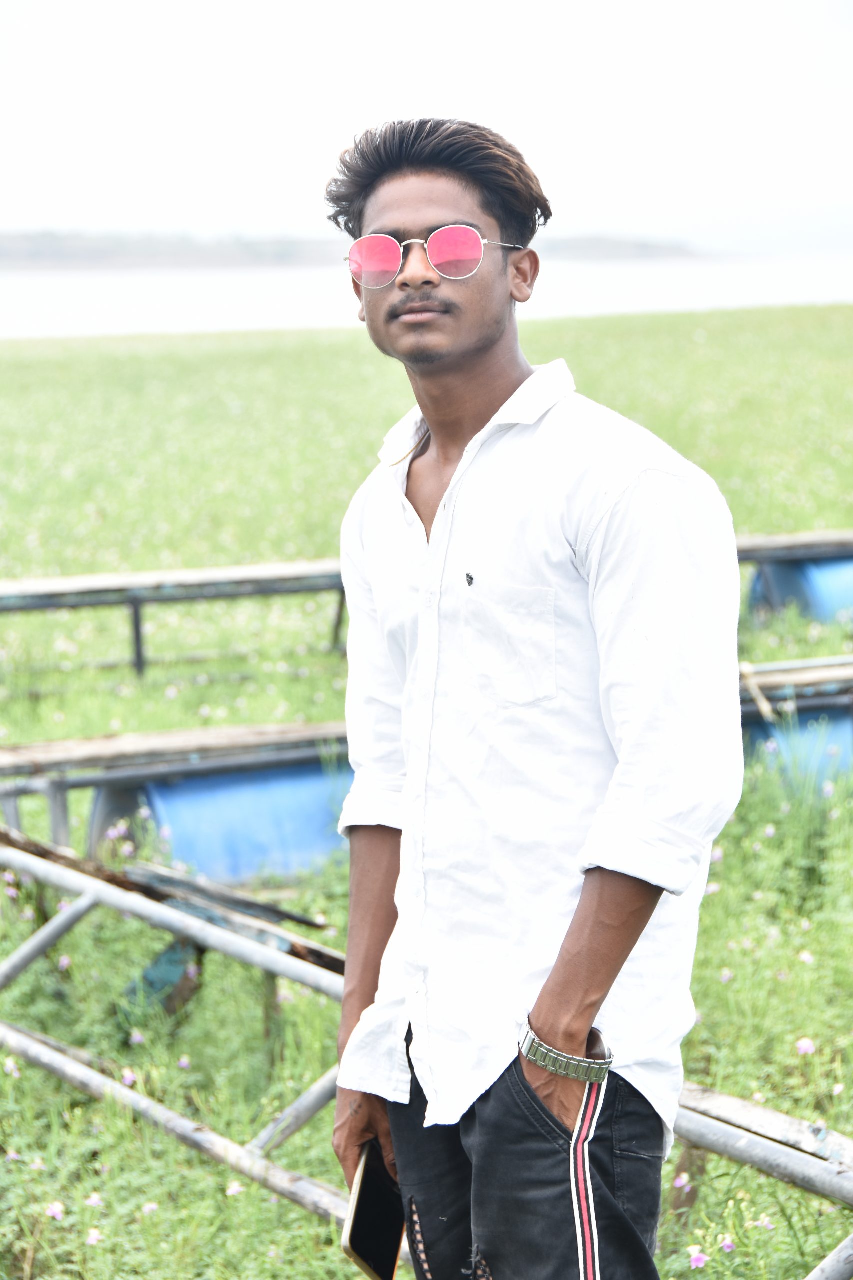 Boy posing in sunglasses