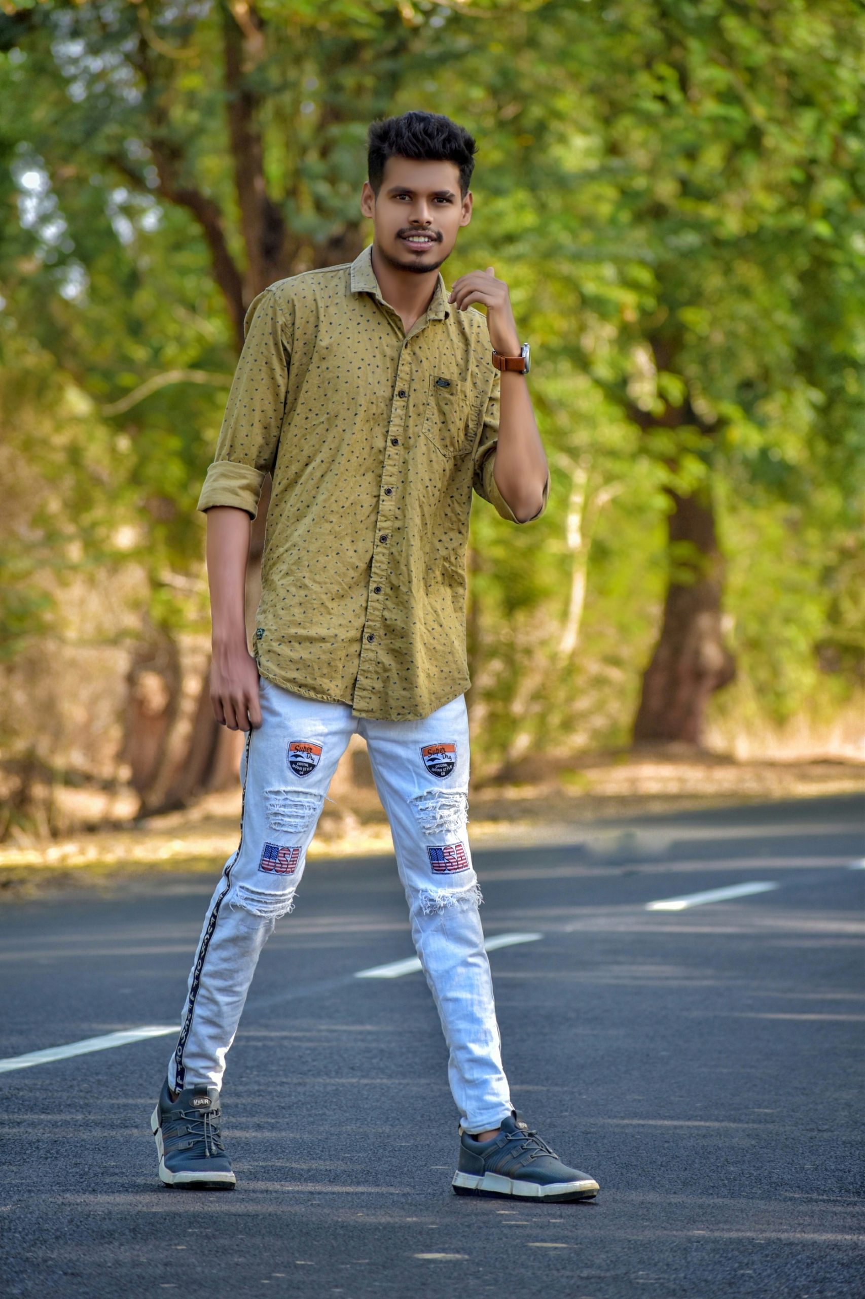 Boy posing on road