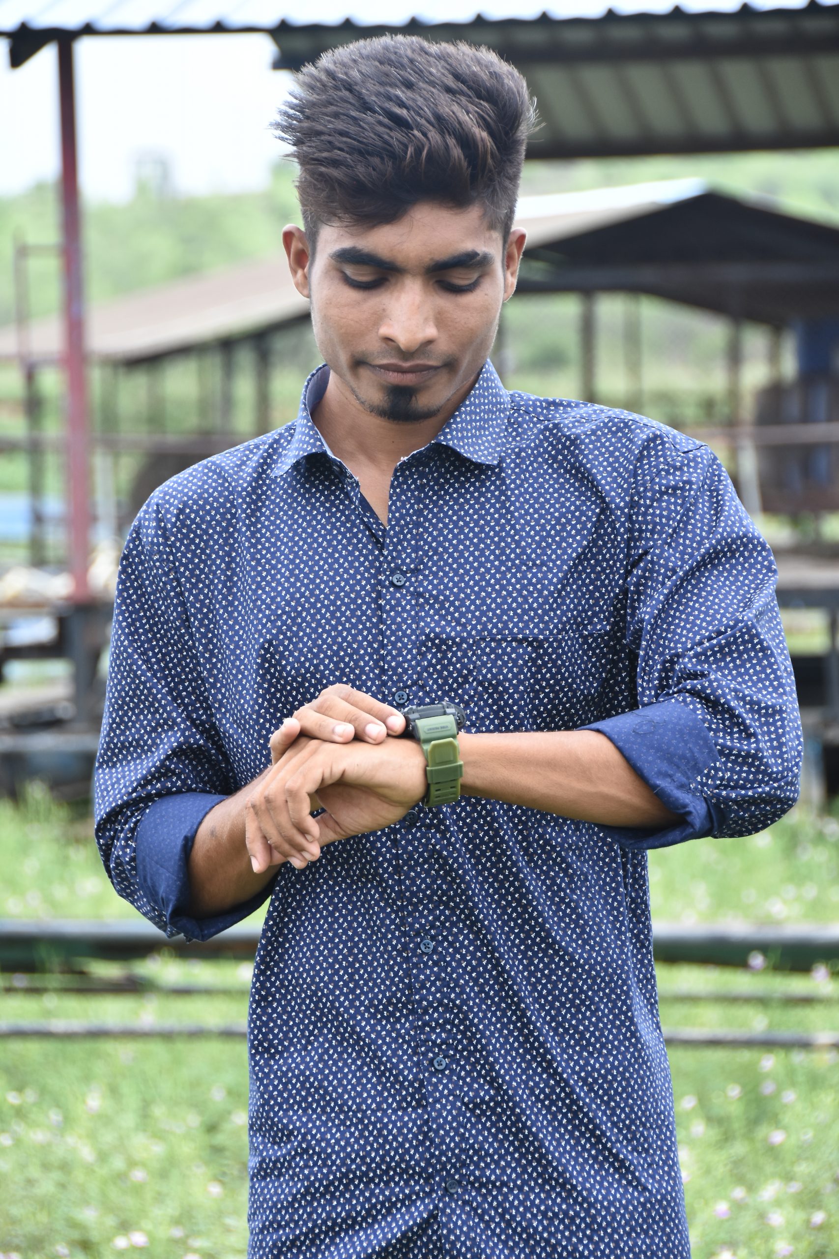 Boy posing with wrist watch
