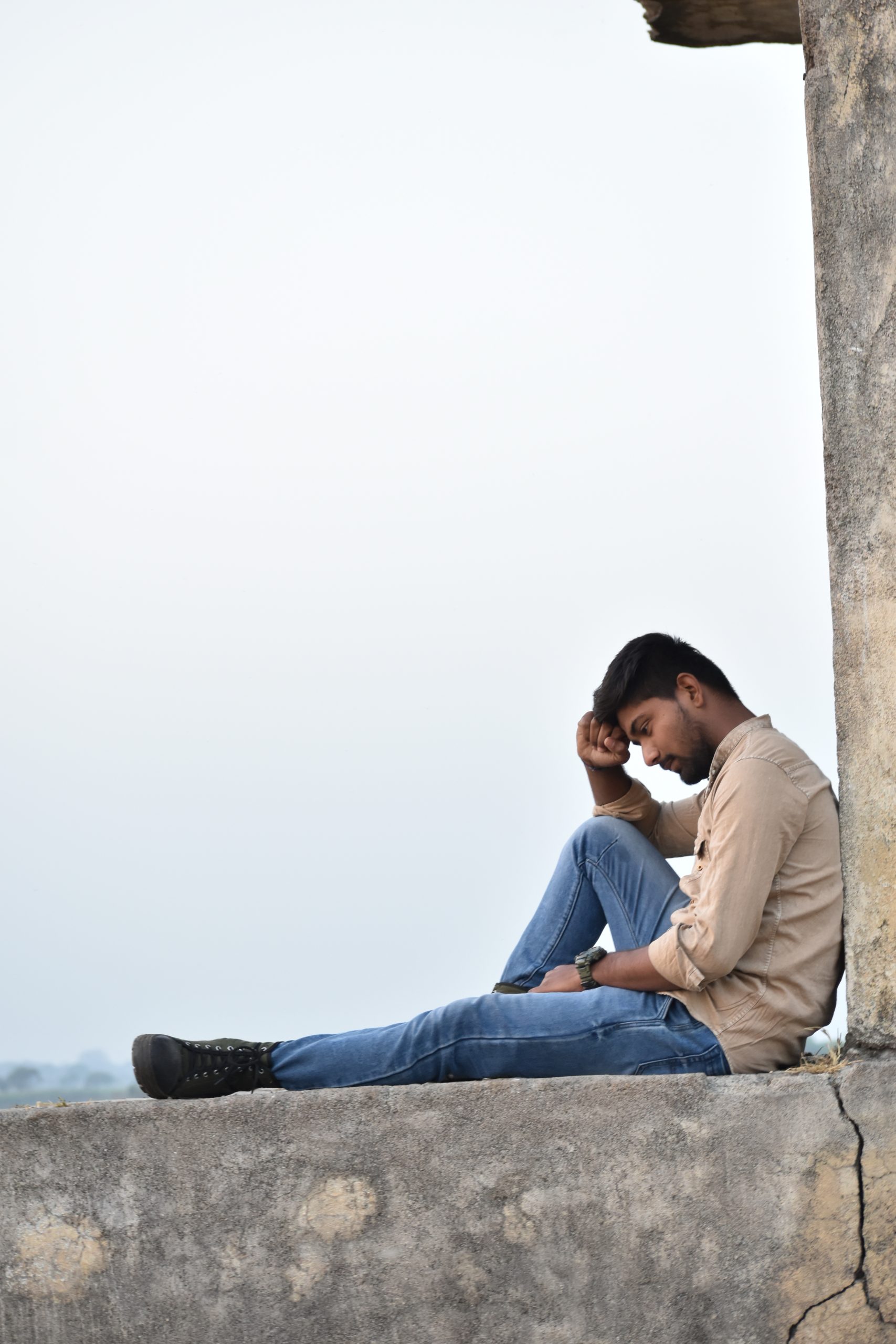 Boy sitting and posing