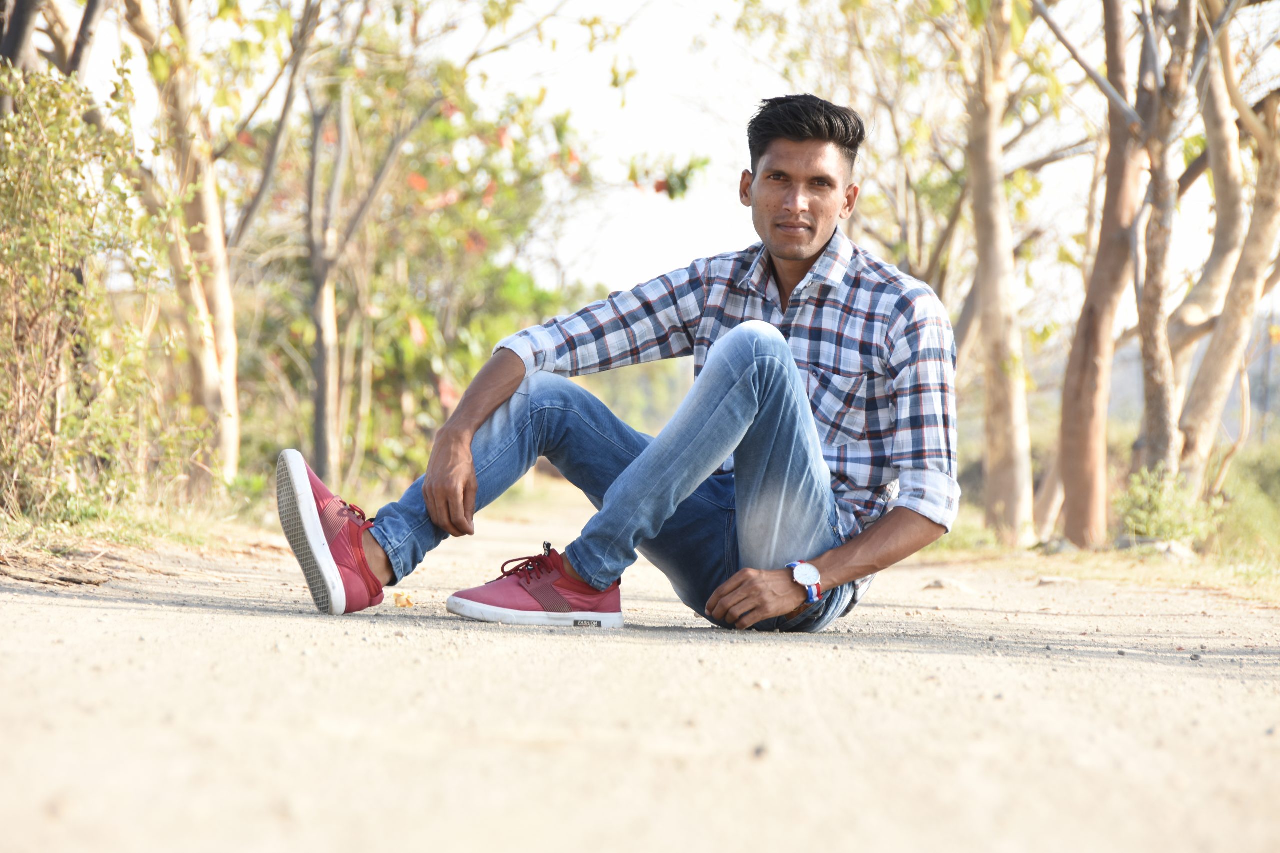 Boy sitting on road