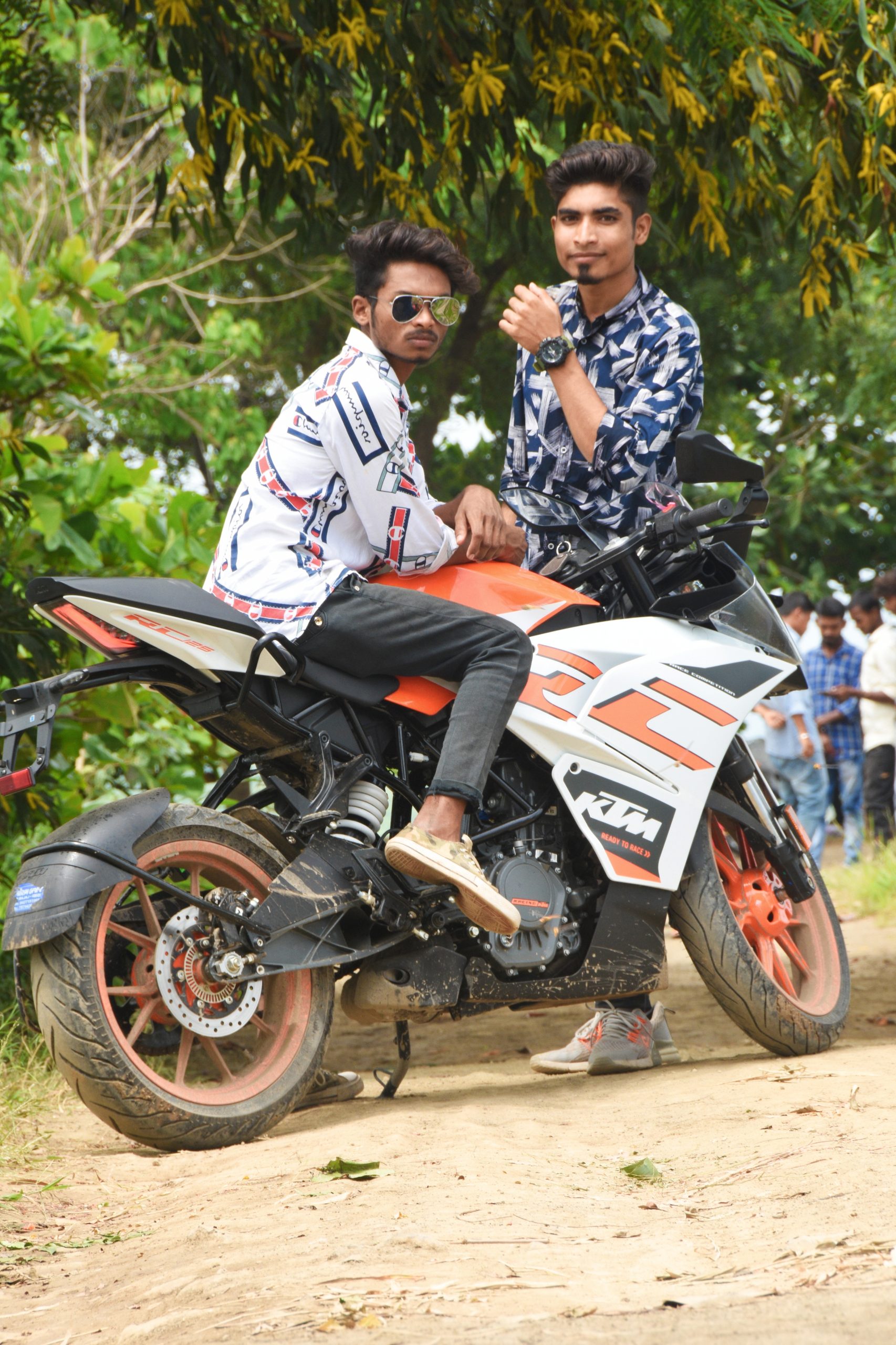 Boys posing on KTM bike