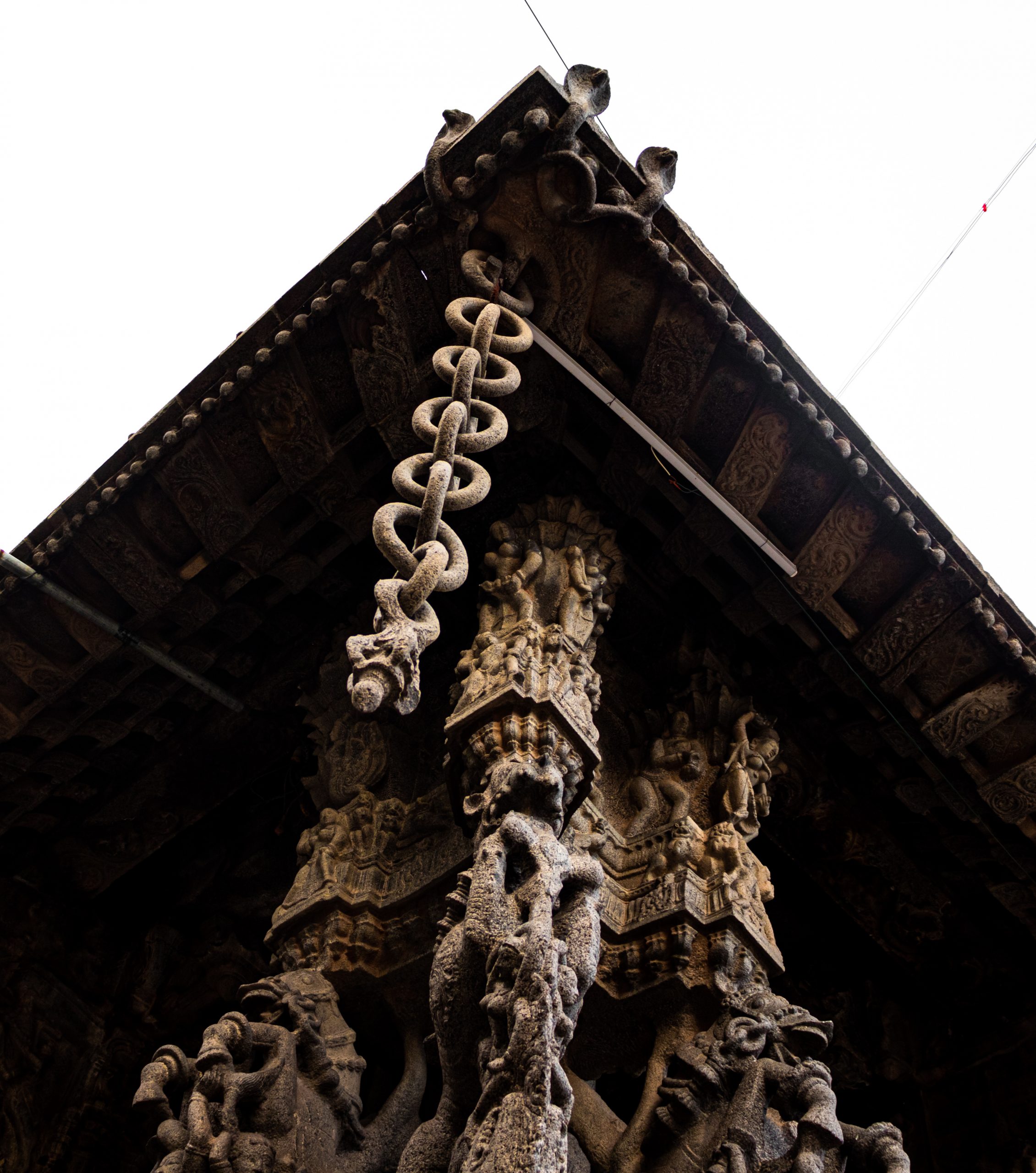 Chain and temple statue under tin shade