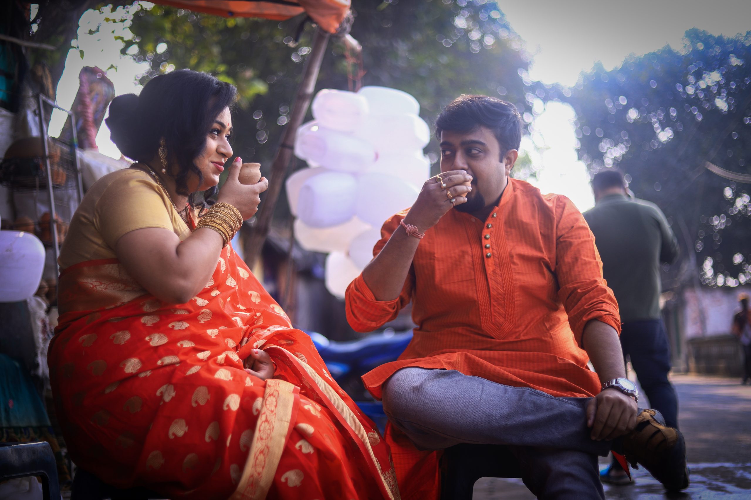 A couple having tea on a stall