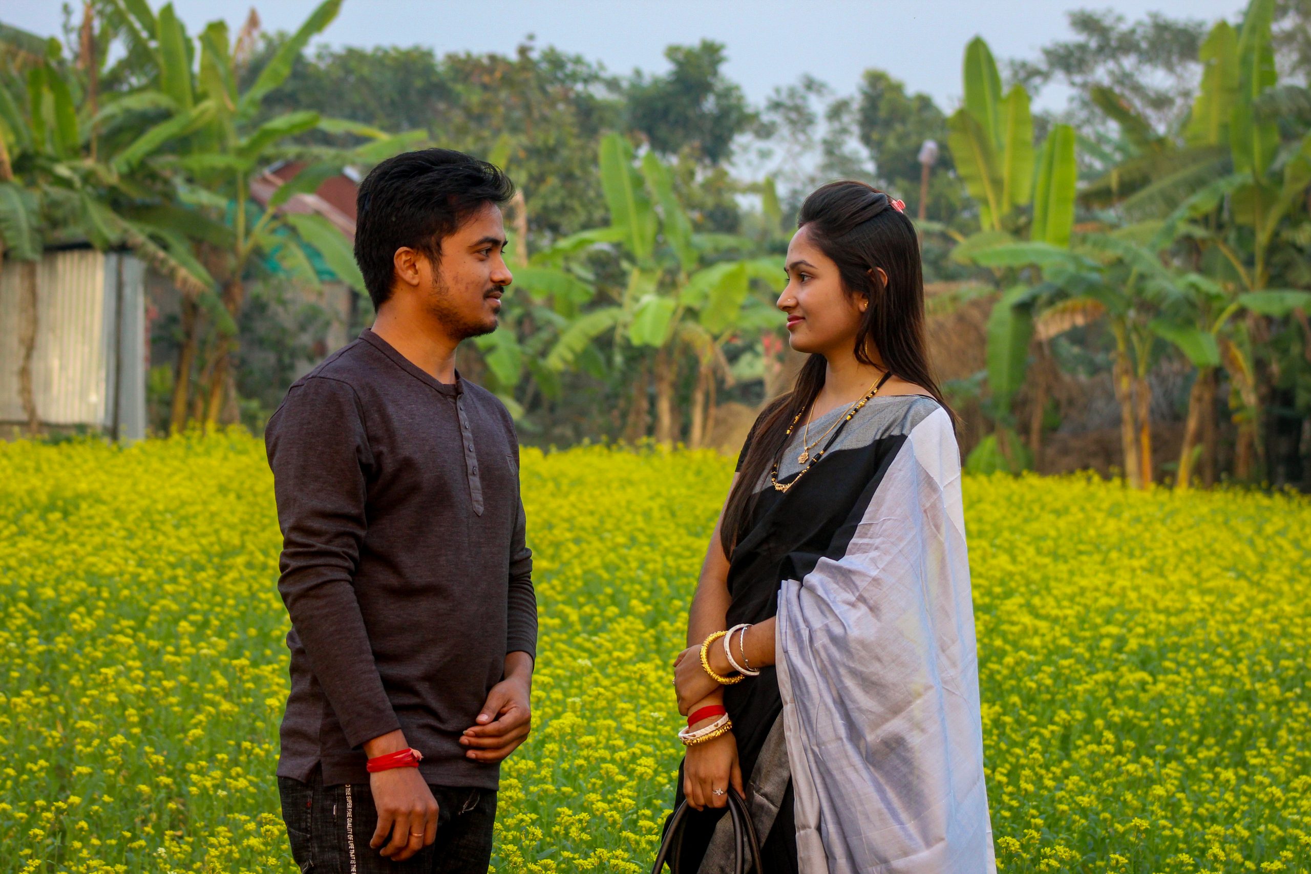 Couple looking at each other in the farm