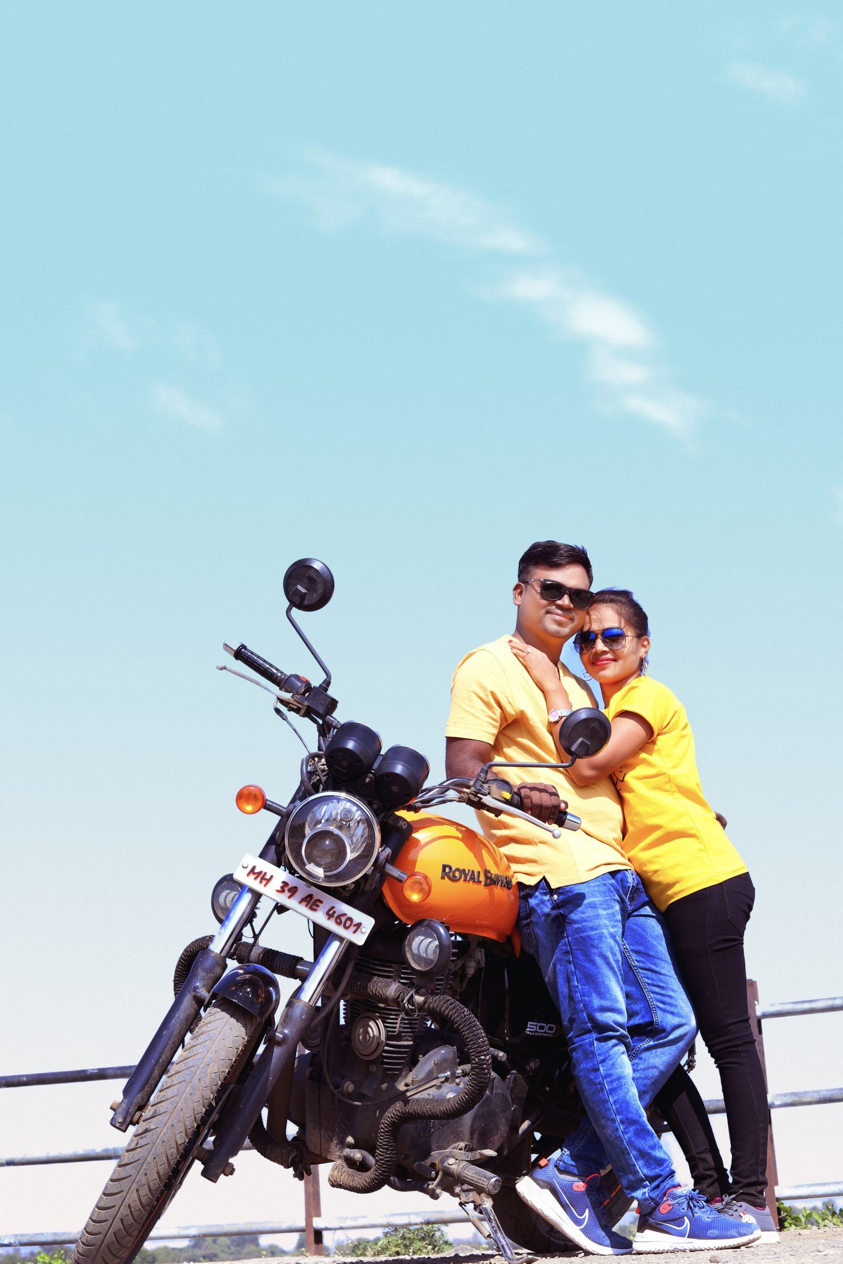 Couples posing on Royal Enfield bike