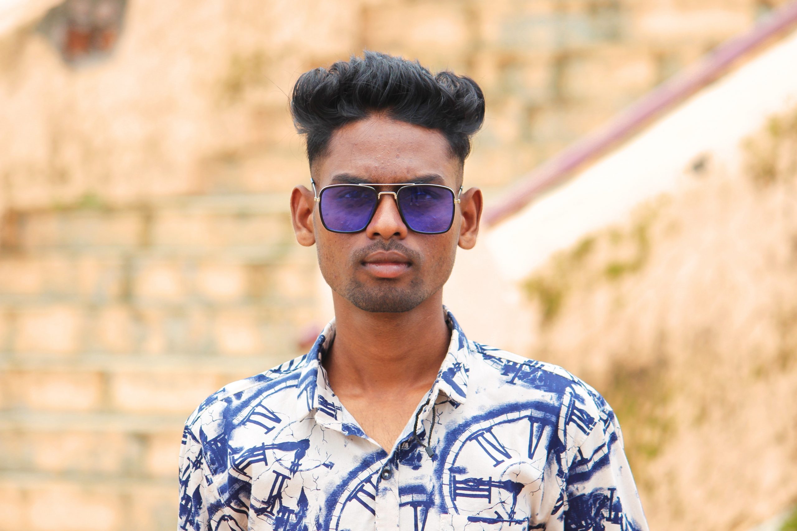 Male Model posing with sunglasses