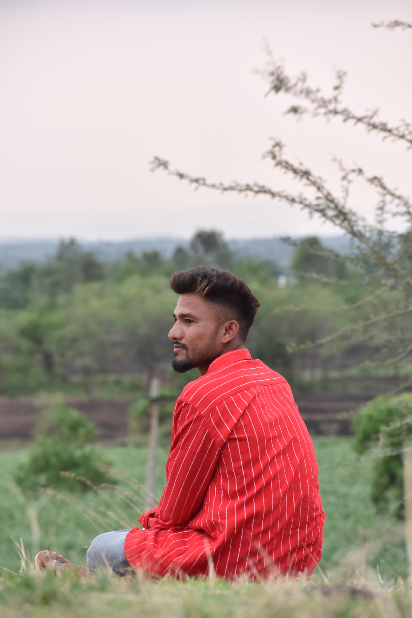 Model boy posing in the farm