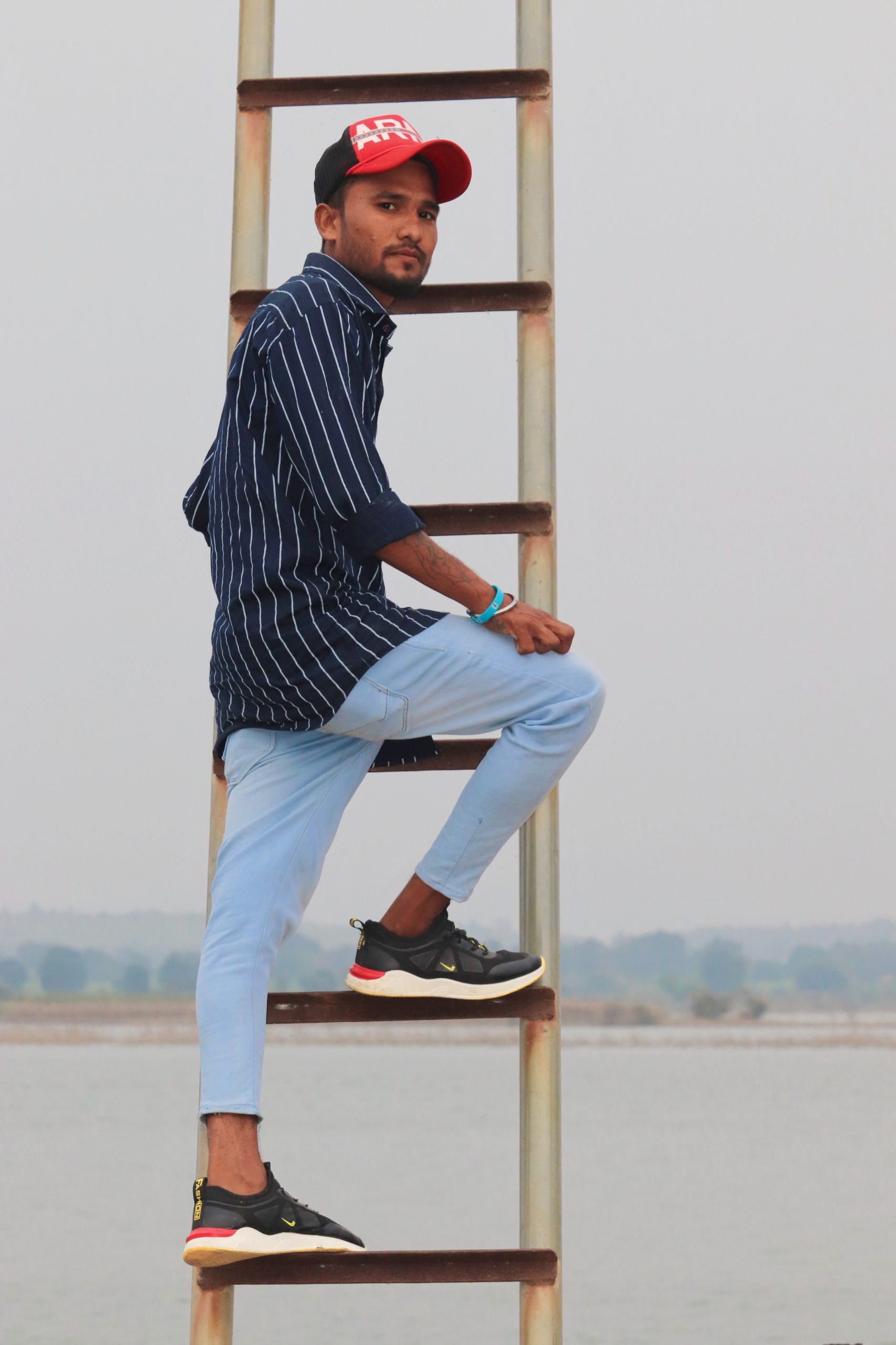 Model posing on iron stairs