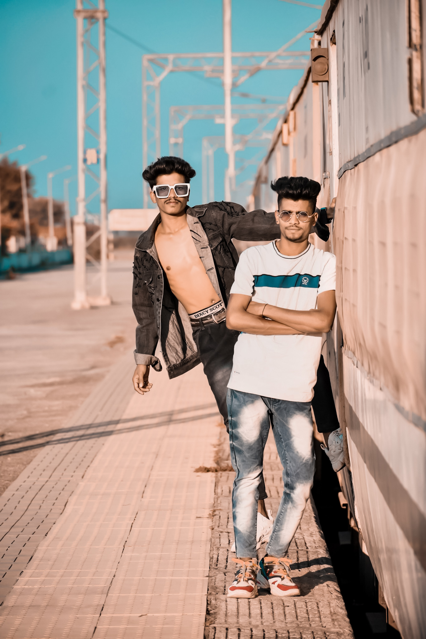Two boys posing roadside