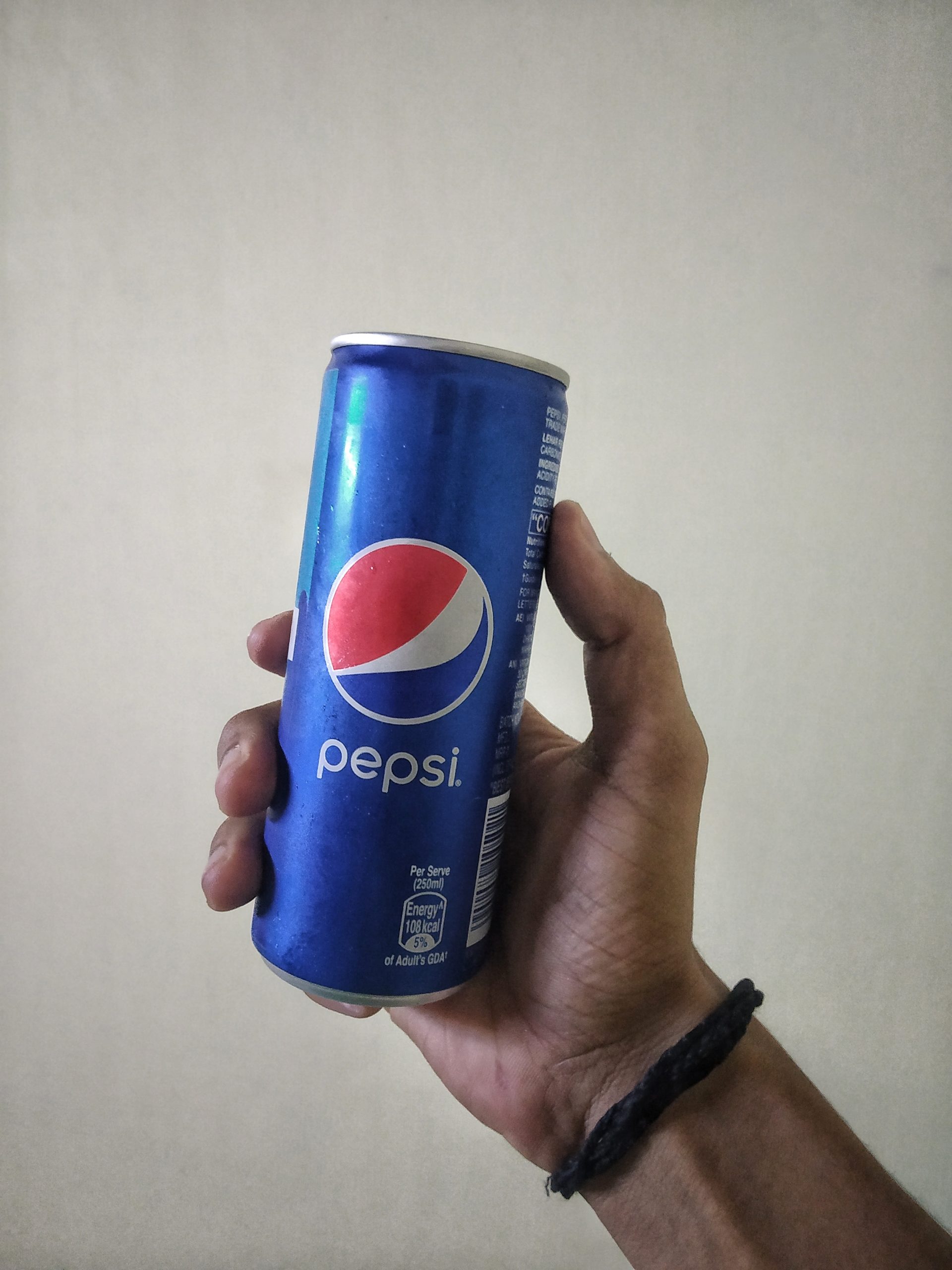 Pepsi can in hand