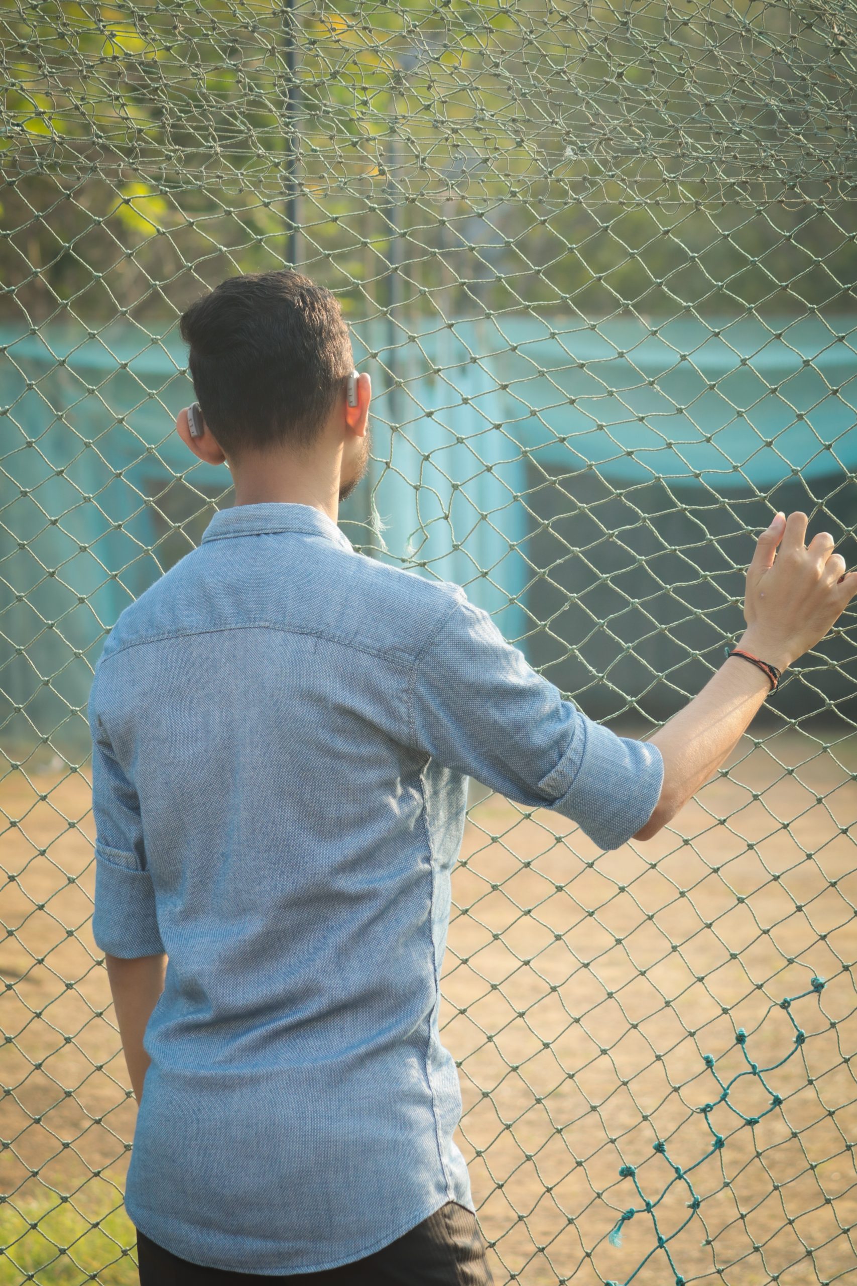 Boy posing near the railing