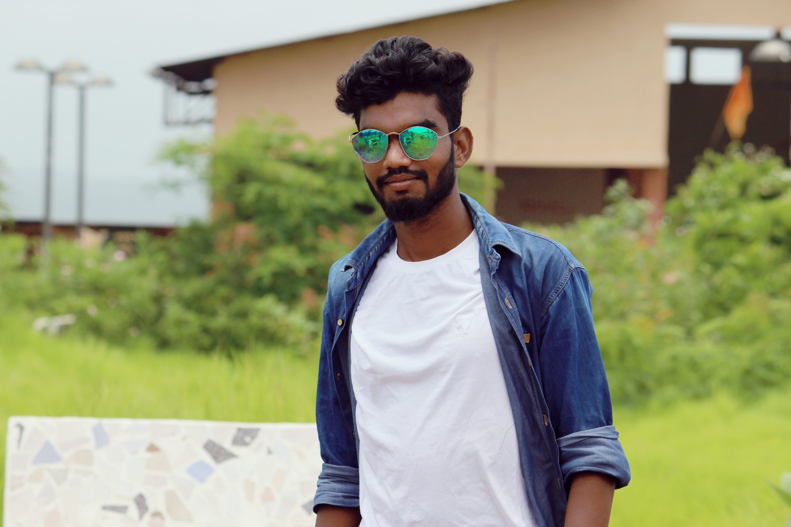 Stylish Pose of an Indian Young Man with sunglasses Stock Photo - Alamy
