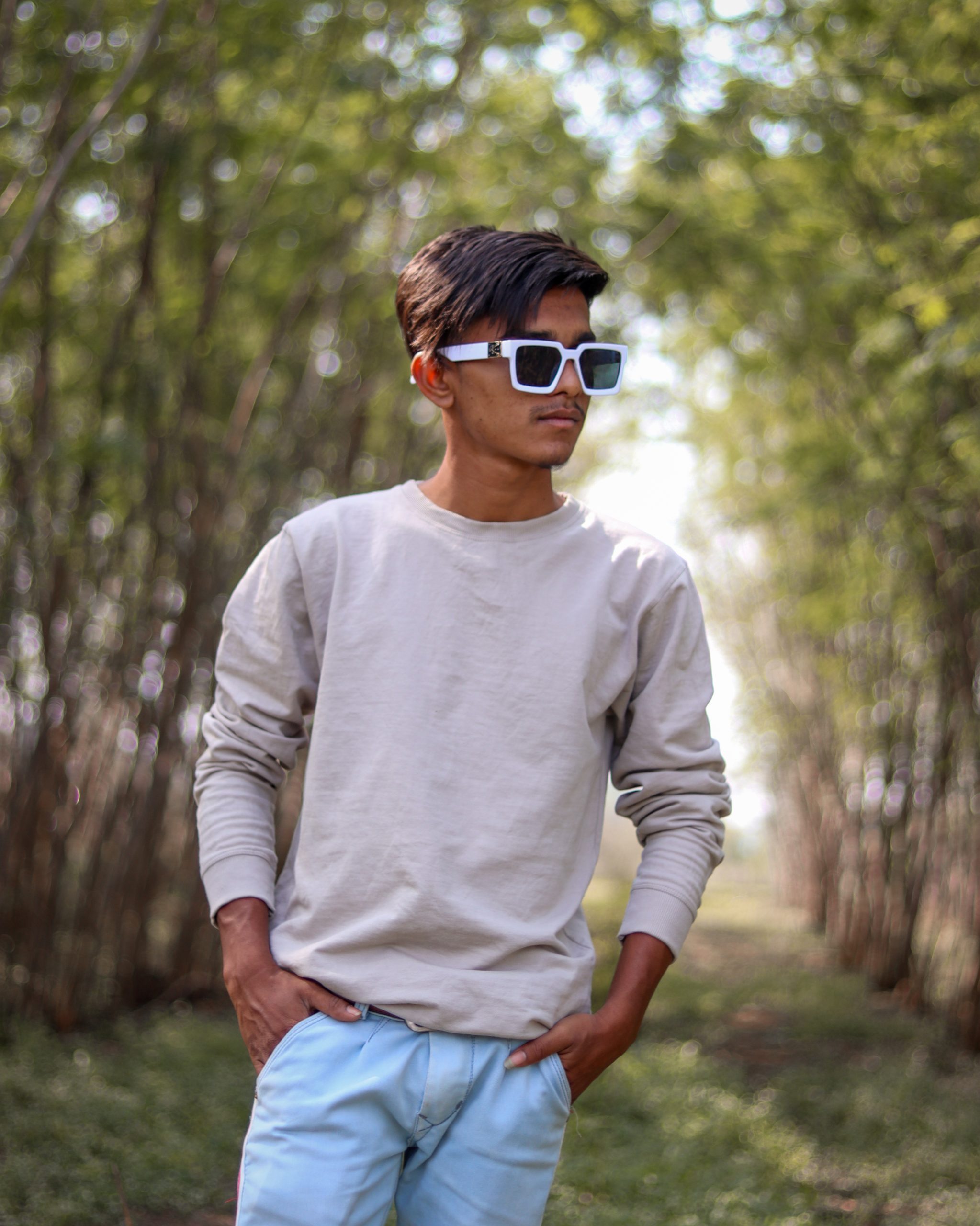 Stylish boy posing with sunglasses