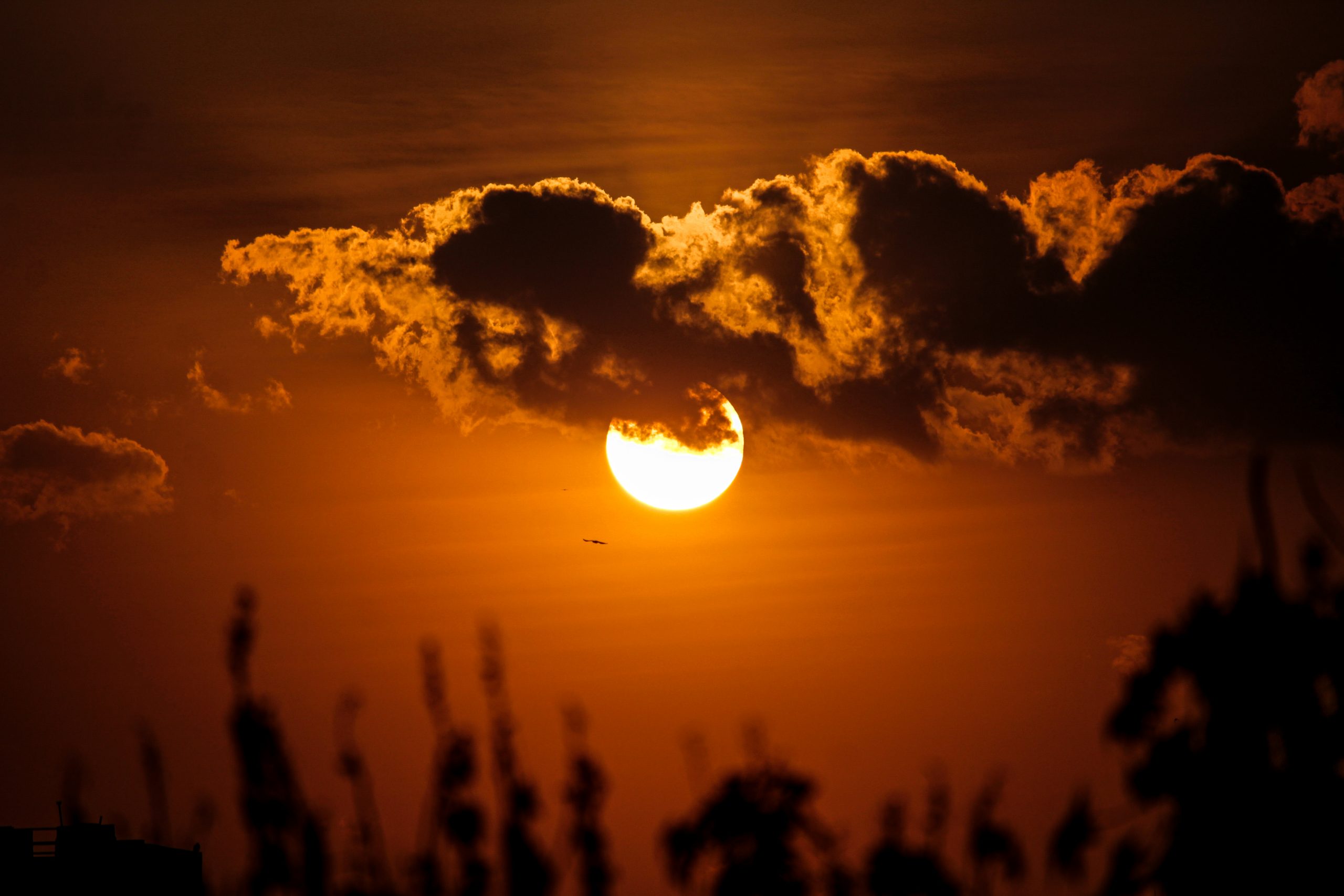 Sunset behind the clouds