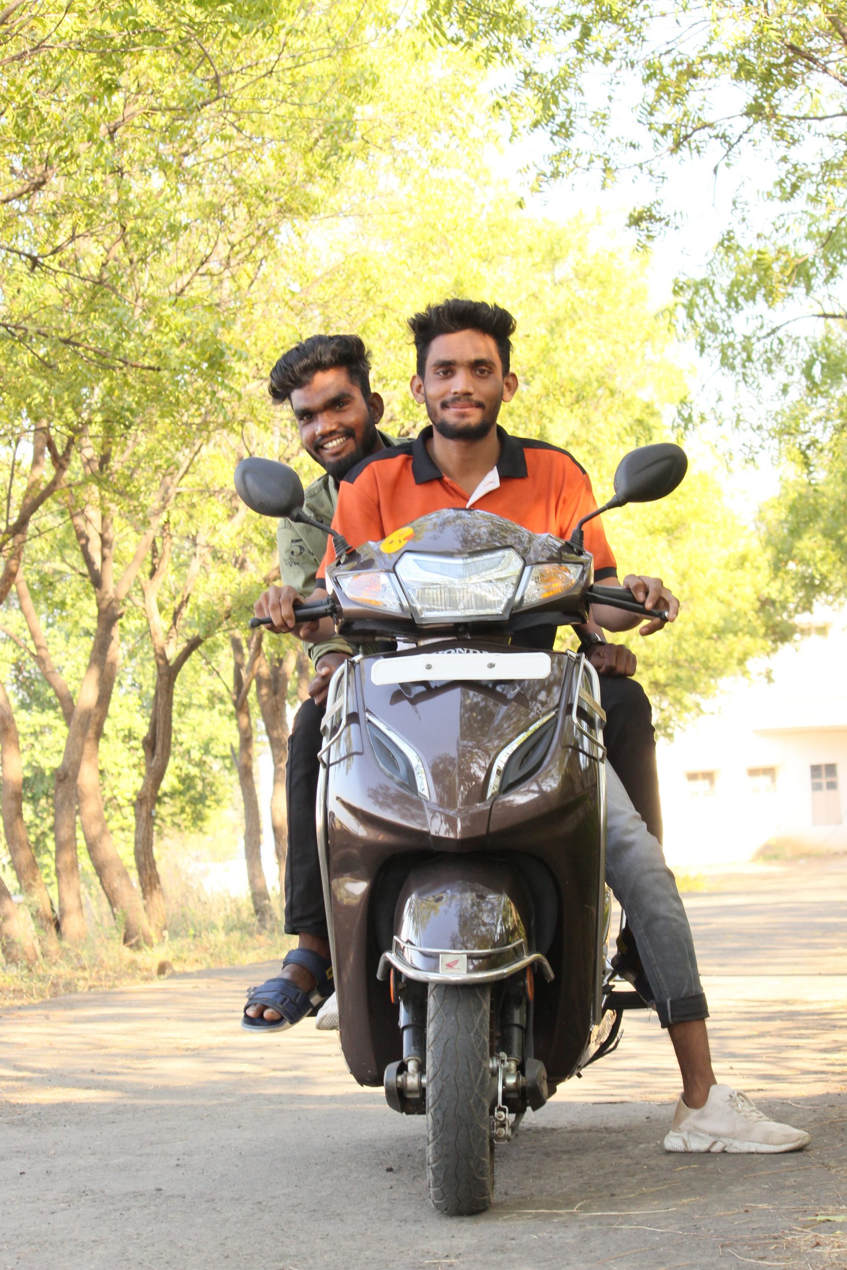 Two boys on scooty