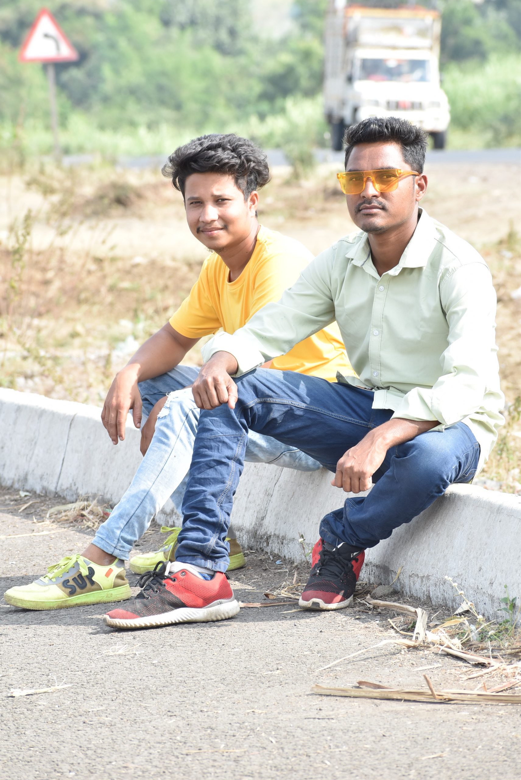 Two boys posing while sitting 339024