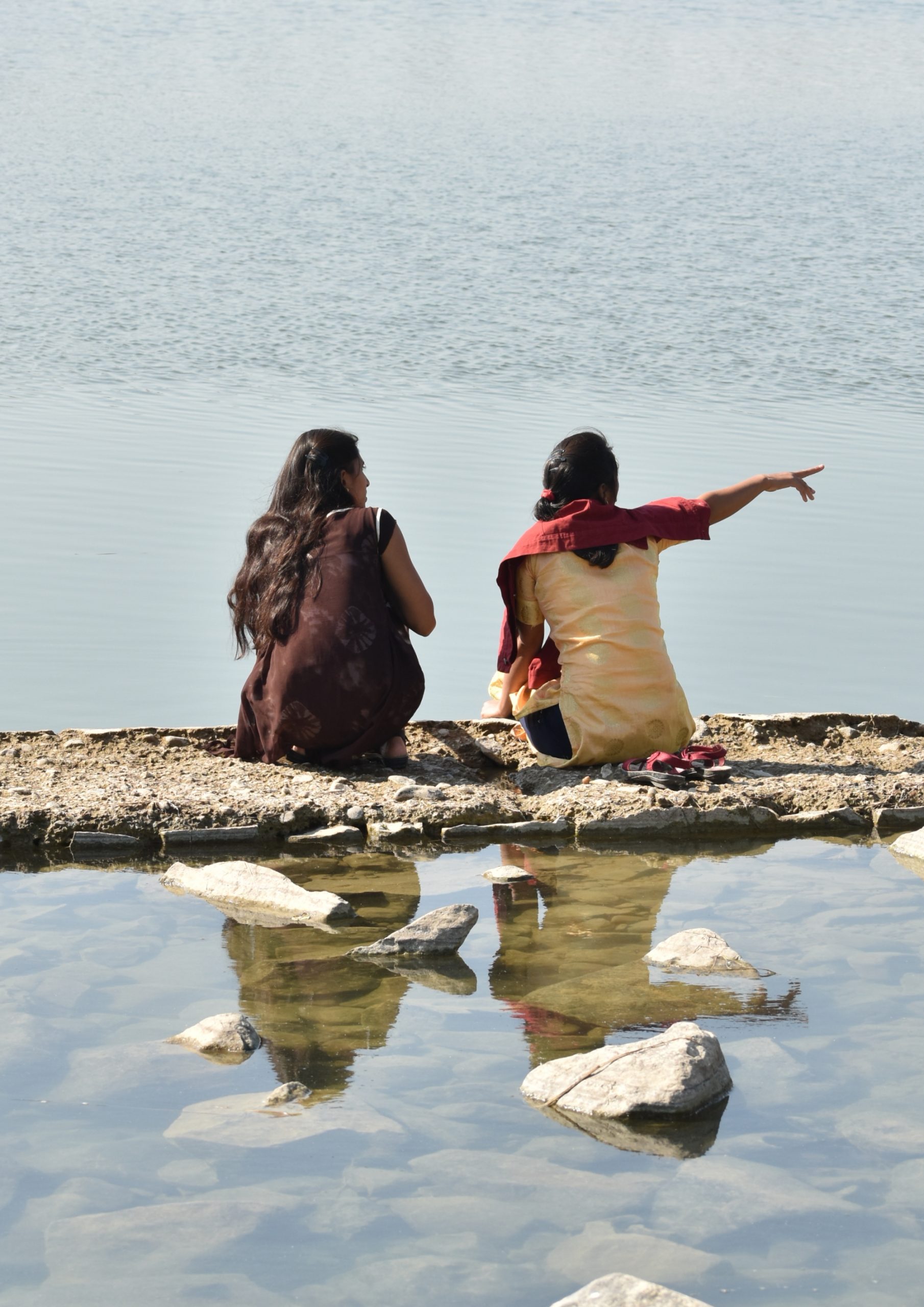 Two girls at riverbank