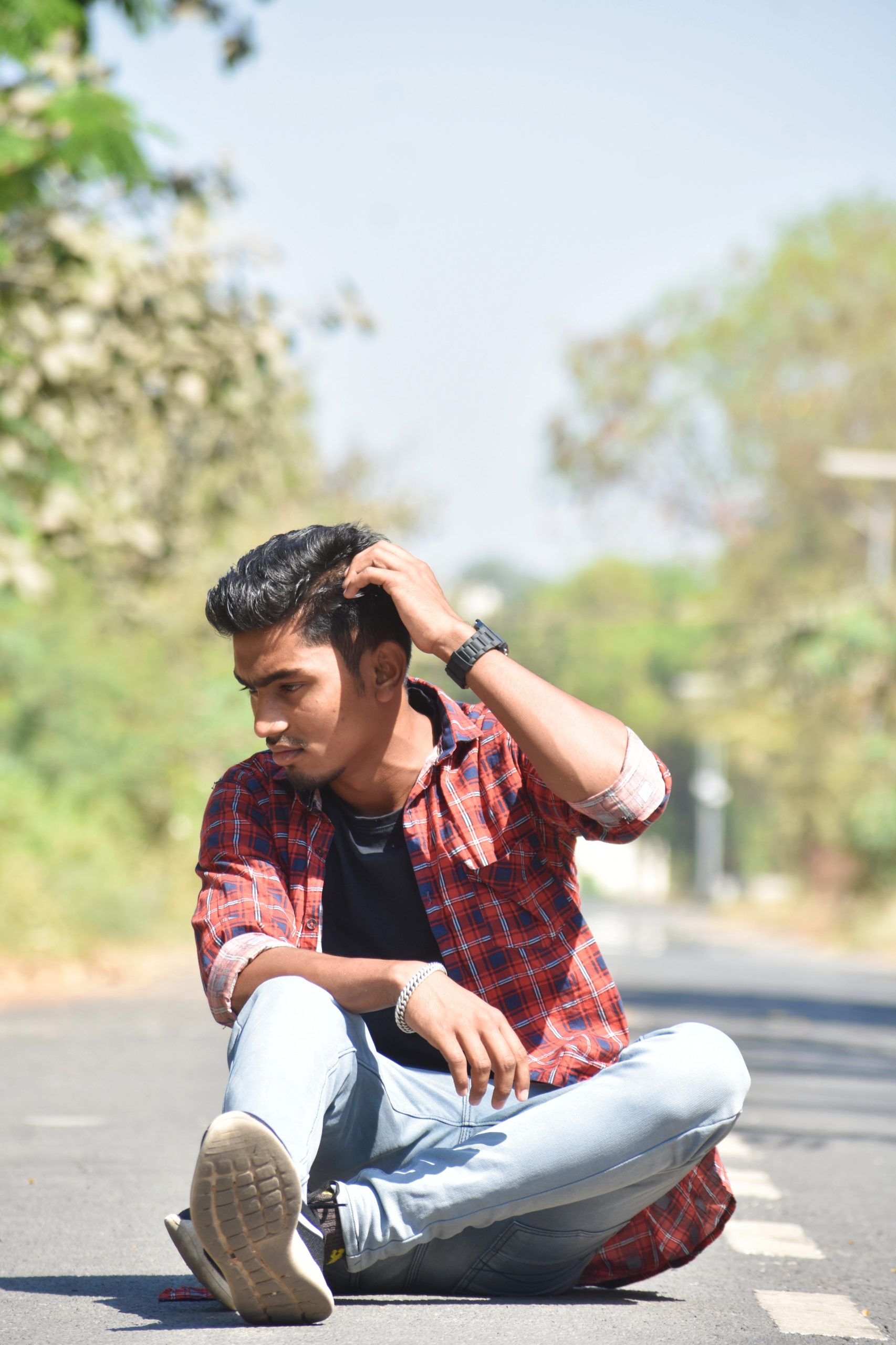 Boy posing on road